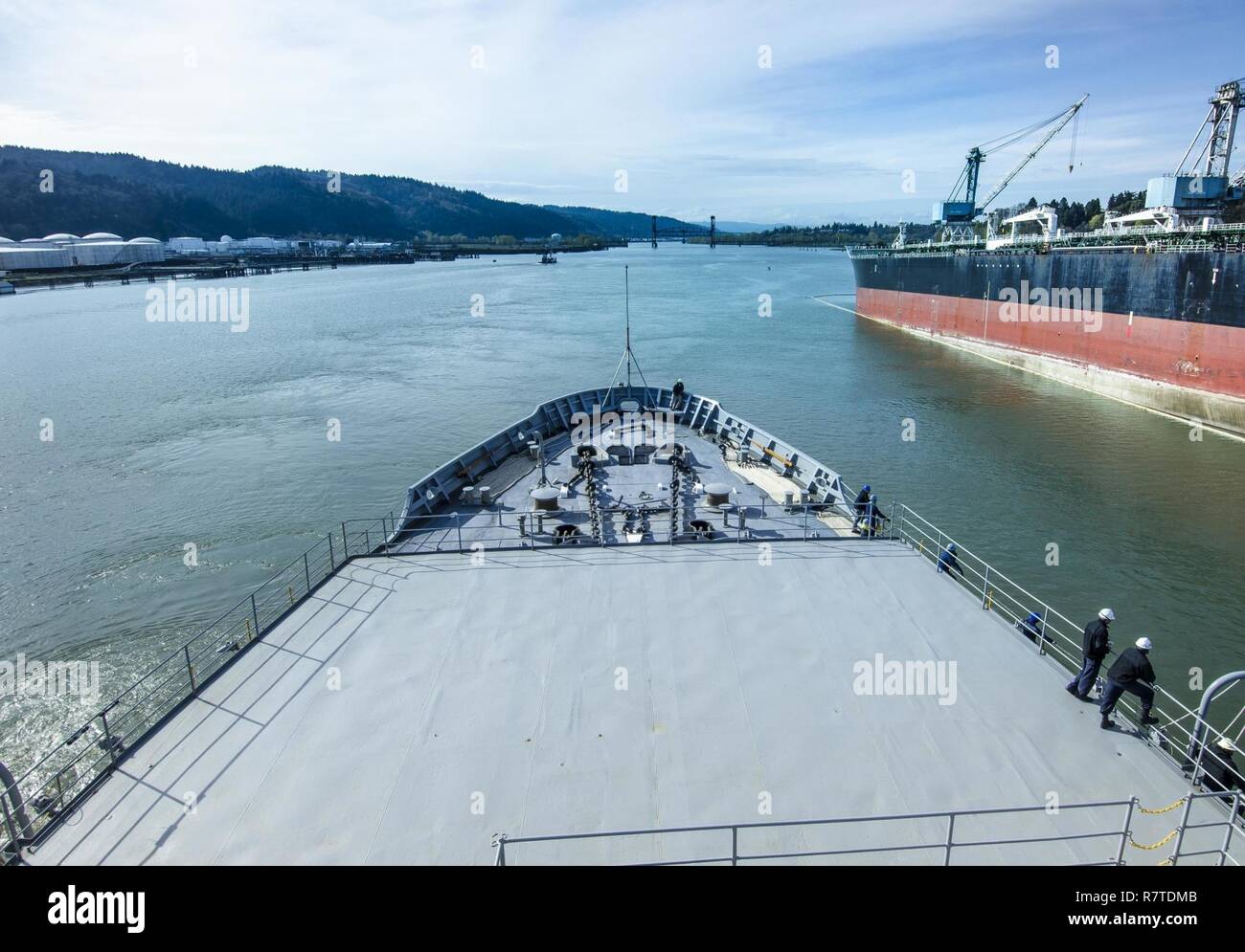 PORTLAND, Ore. (April 6, 2017) - The submarine tender USS Frank Cable (AS 40) transits the Columbia River toward her final destination of Portland, Ore., April 6. Frank Cable is in Portland, Ore. for a scheduled dry-dock phase maintenance availability. Stock Photo