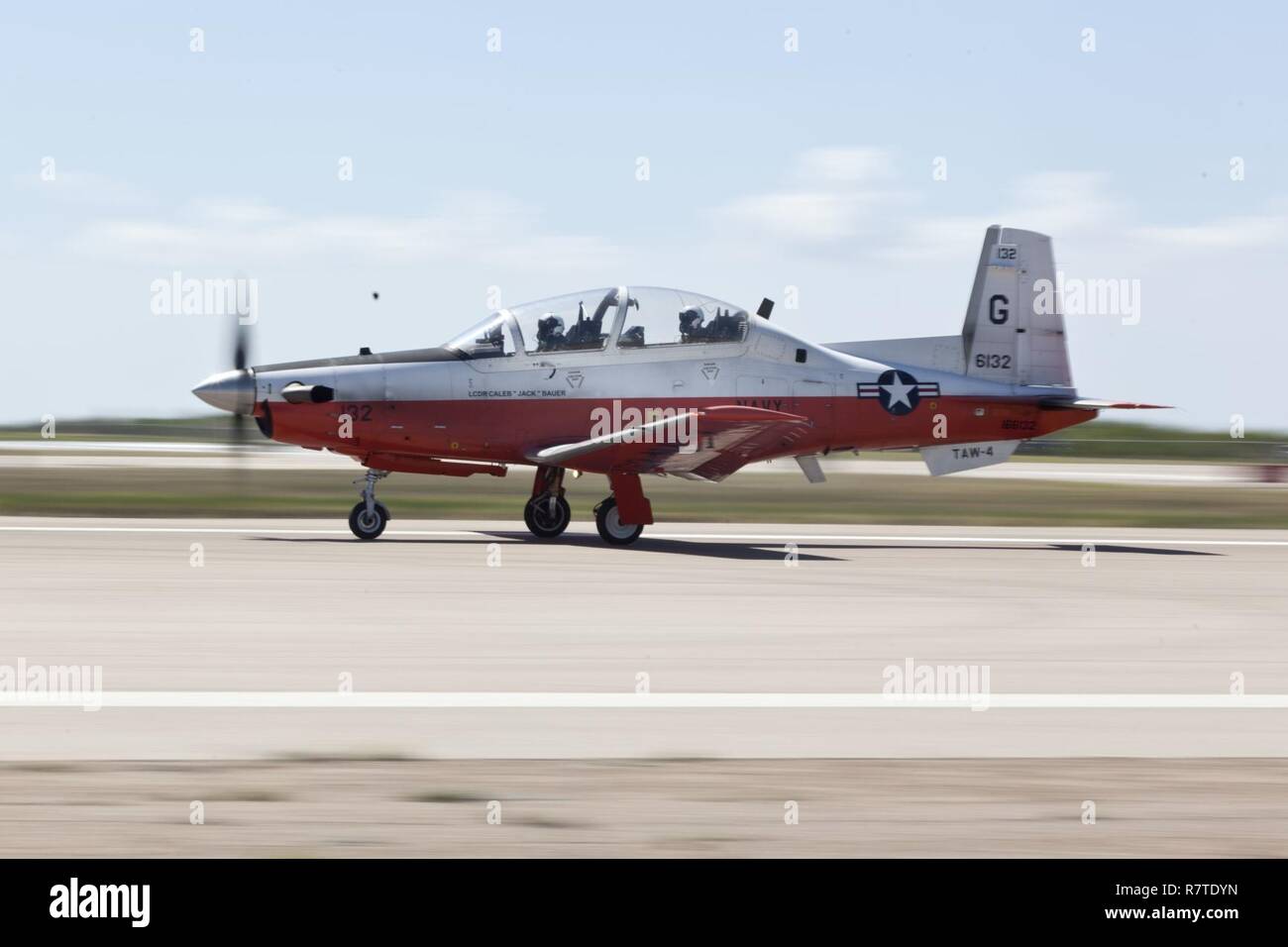 U.S. Marine Corps officers assigned to the Basic Flight Training Course, Training Air Wing Four, land a T-6B training aircraft at Naval Air Station Corpus Christi, Texas, March 20, 2017. The mission of Training Air Wing Four is to provide basic flight training as well as intermediate and advanced flight training using multi-engine aircraft. Stock Photo