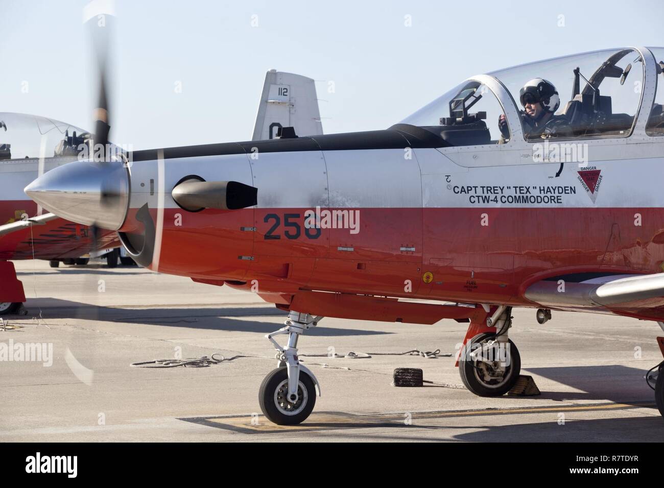 U.S. Marine Corps officers assigned to the Basic Flight Training Course, Training Air Wing Four, conduct a preflight check on a T-6B training aircraft at Naval Air Station Corpus Christi, Texas, March 20, 2017. The mission of Training Air Wing Four is to provide basic flight training as well as intermediate and advanced flight training using multi-engine aircraft. Stock Photo