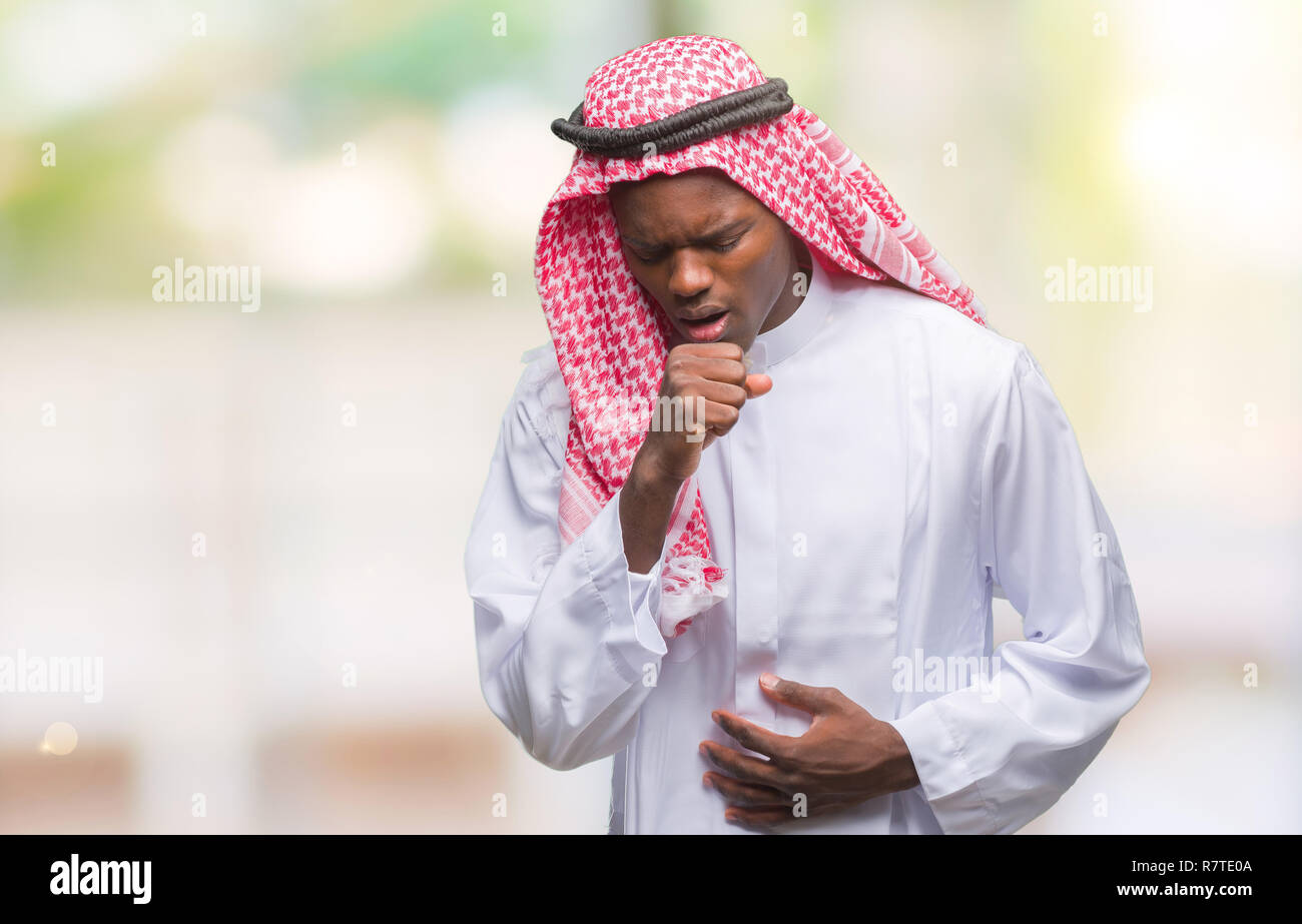 Young arabic african man wearing traditional keffiyeh over isolated