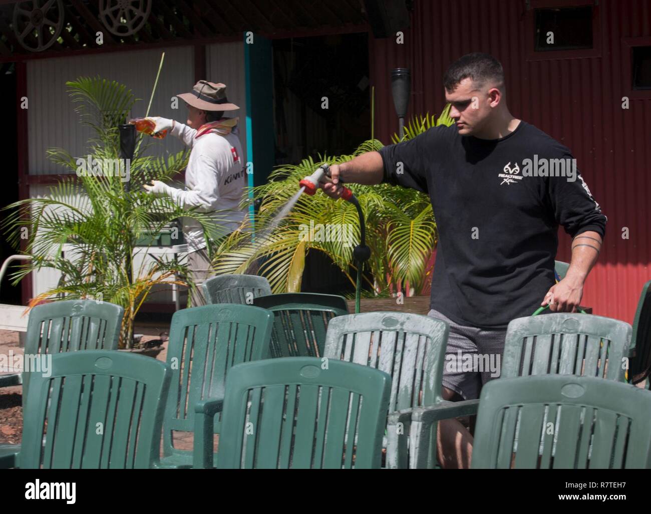 U.S. Marine Corps Sgt. Phillip O’Shea, data chief for the Forward Coordination Element of Marine Rotational Force Darwin (MRF-D), volunteers at an outdoor cinema in Darwin, Australia, Apr 8, 2017. Marines with MRF-D are fully committed to the alliance with Australia and show that by helping the nearby communities. Stock Photo