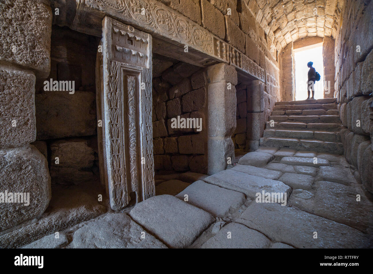 Visitor at North entry of Arabic water cistern at Alcazaba citadel. Merida, Extremadura, Spain. Interior view Stock Photo