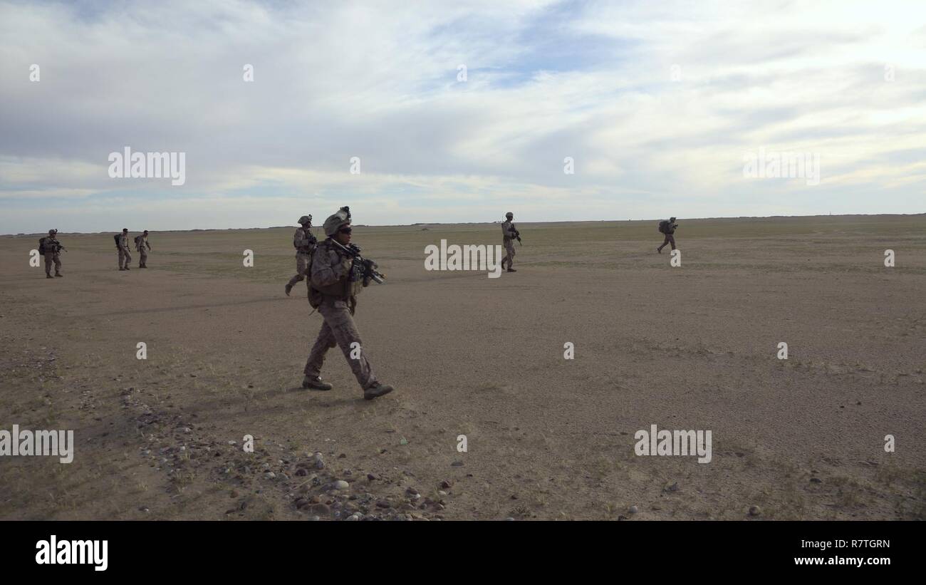 U.S. Marines with 1st Battalion 7th Marines, Special Purpose Marine Air-Ground Task Force-Crisis Response-Central Command, patrol an area during a Tactical Recovery of Aircraft and Personnel exercise while forward deployed in the Middle East, April 5, 2017. These Marines are part of the dedicated TRAP force of 1/7, the ground combat element for the Special Purpose MAGTF. SPMAGTF-CR-CC is currently forward deployed to several nations in CENTCOM with the ability to respond to a variety of contingencies rapidly and effectively. Stock Photo