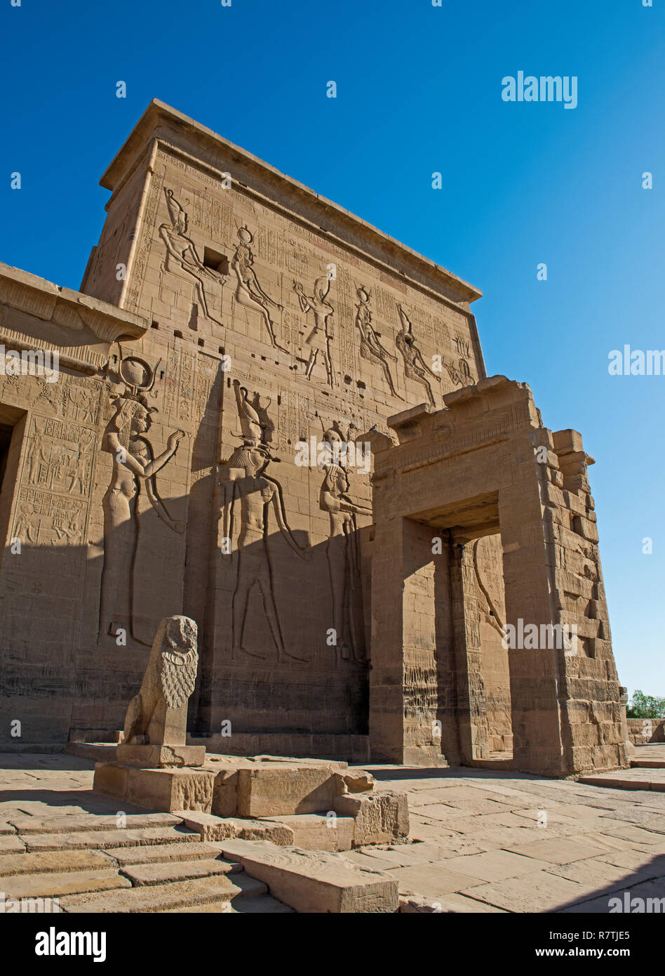 Hieroglypic carvings on wall at the entrance to ancient egyptian Temple of Isis in Philae Island Aswan Stock Photo