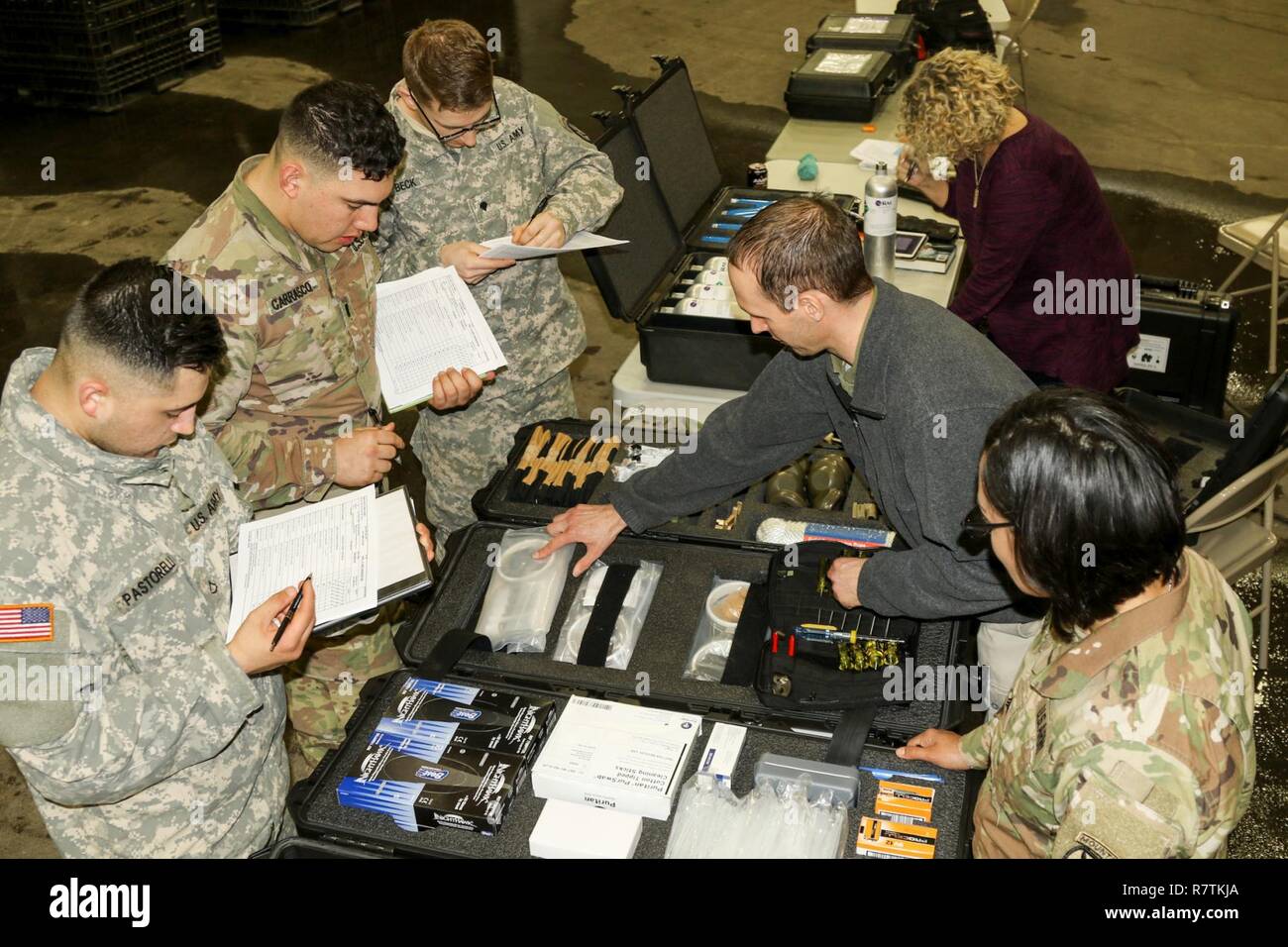 Soldiers of 10th Mountain Division conduct inventory of the parts and components of the new Chemical, Biological, Radiological, Nuclear Dismounted Reconnaissance Sets, Kits and Outfits (CBRN DR at