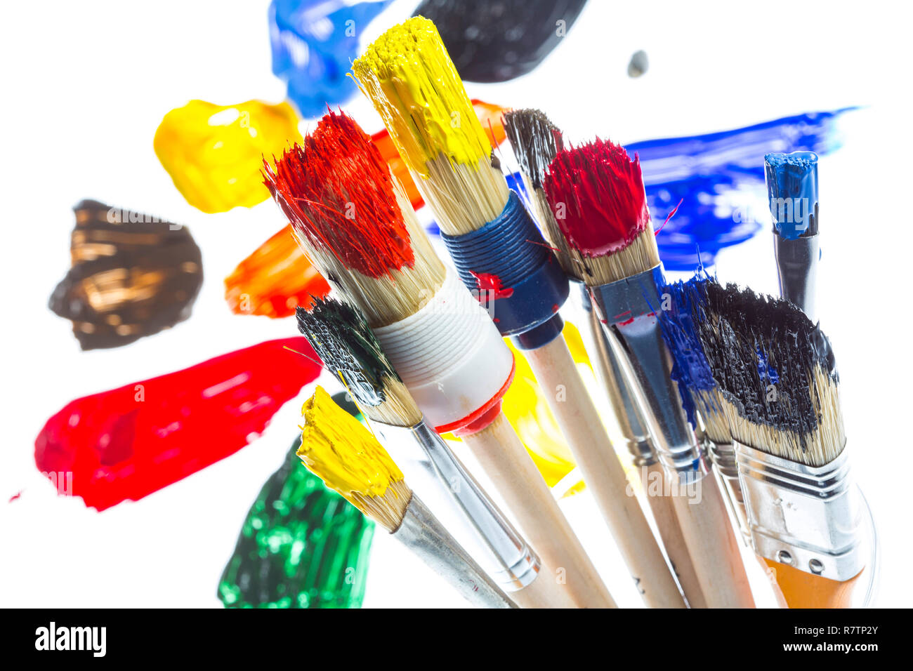 Different types of brushes with colourful acrylic paints Stock Photo