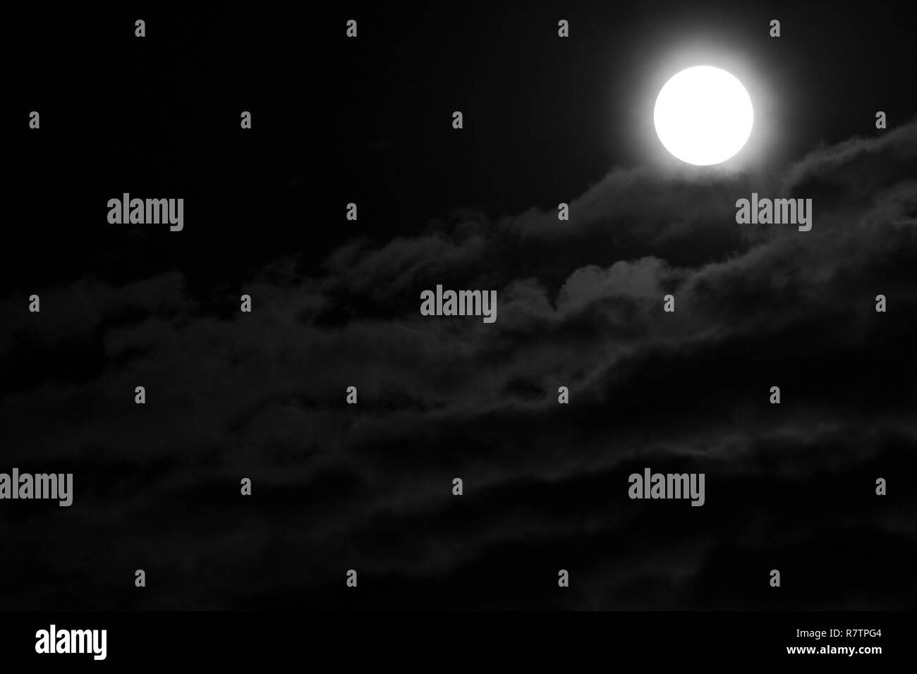 Full Moon and clouds on the night sky Stock Photo - Alamy