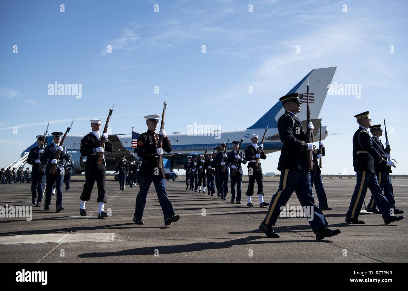 U.S. service members with the Joint Forces Honor Guard exit after participating in a departure ceremony for former President George H.W. Bush in front of the Special Air Mission 41 aircraft at Ellington Field Joint Reserve Base in Houston, Texas, Dec. 3, 2018. Nearly 4,000 military and civilian personnel from across all branches of the U.S. armed forces, including Reserve and National Guard components, provided ceremonial support during George H. W. Bush’s, the 41st President of the United States state funeral. Stock Photo