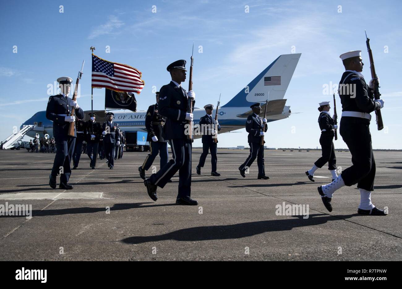 U.S. service members with the Joint Forces Honor Guard exit after participating in a departure ceremony for former President George H.W. Bush in front of the Special Air Mission 41 aircraft at Ellington Field Joint Reserve Base in Houston, Texas, Dec. 3, 2018. Nearly 4,000 military and civilian personnel from across all branches of the U.S. armed forces, including Reserve and National Guard components, provided ceremonial support during George H.W. Bush’s, the 41st President of the United States state funeral. Stock Photo