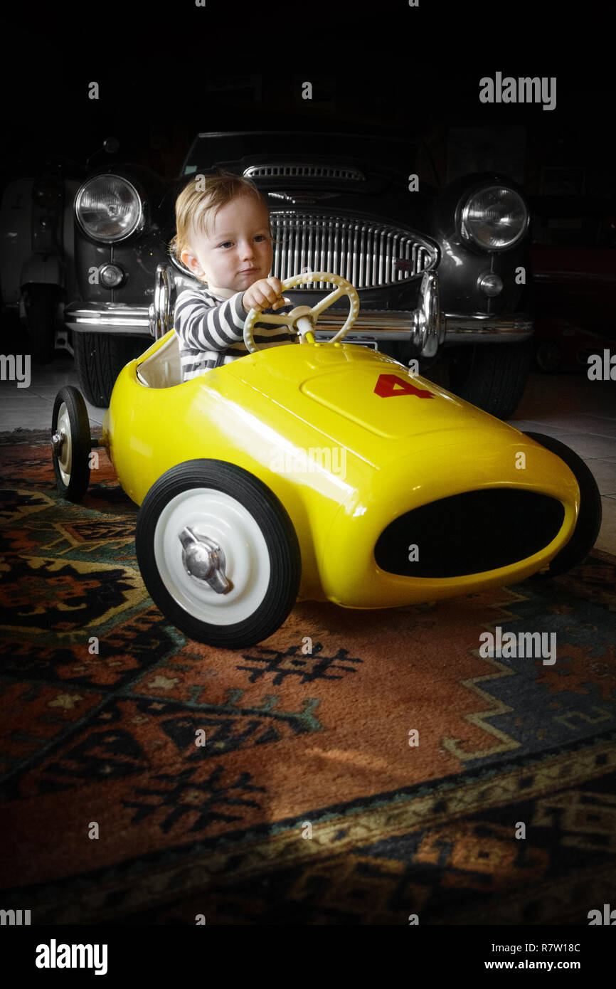Baby boy driving toy car Stock Photo Alamy