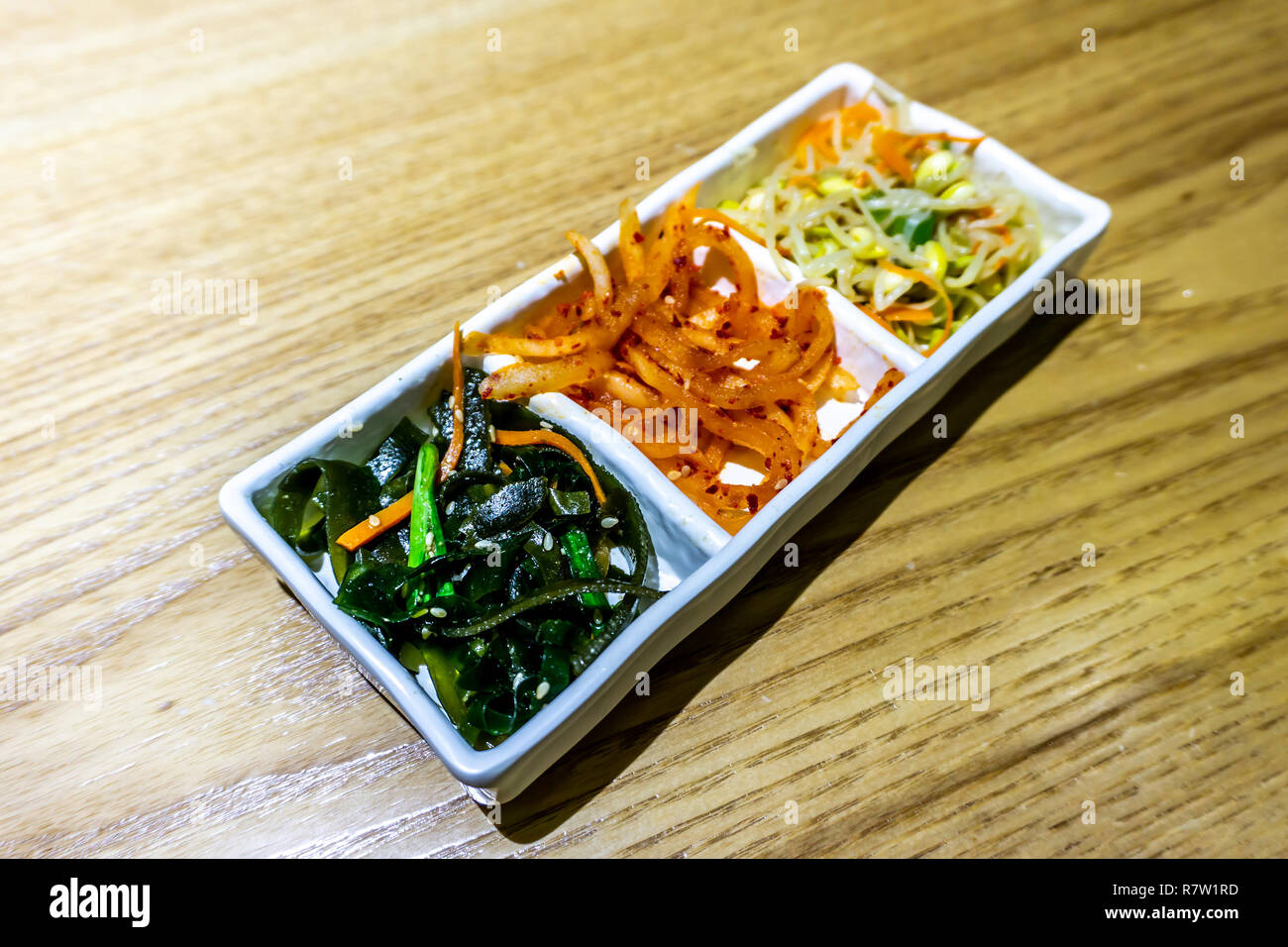 Korean Side Dishes with Bean Sprouts Seasoned Sea Weed and Sliced
