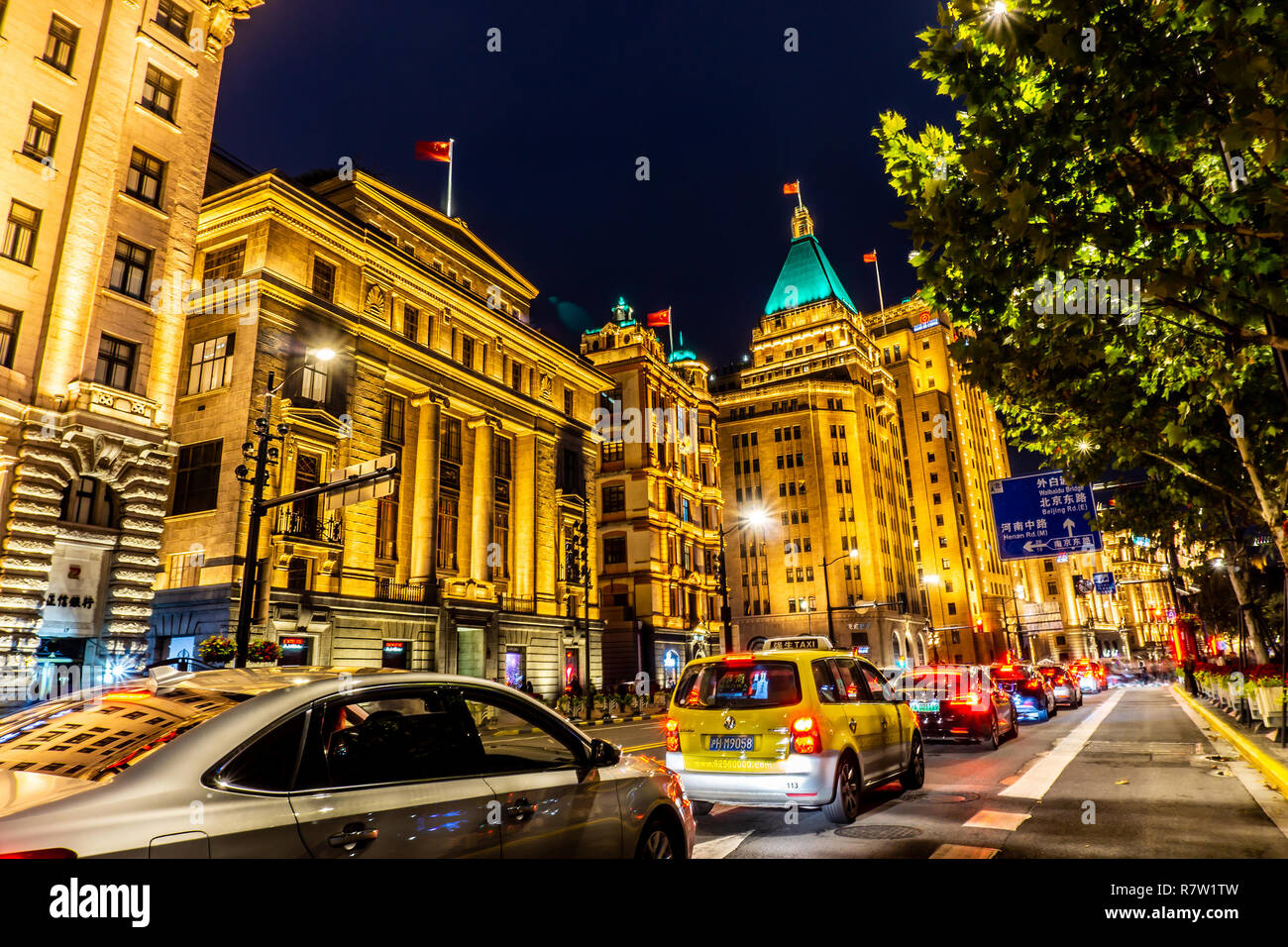 Shanghai The Bund Promenade Commercial Buildings at Night with Cars at Red Traffic Light Stock Photo
