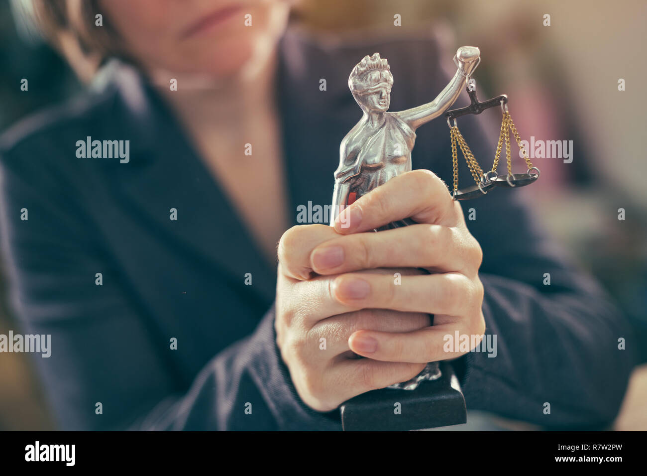 State attorney holding statue of Justice in office, selective focus Stock Photo