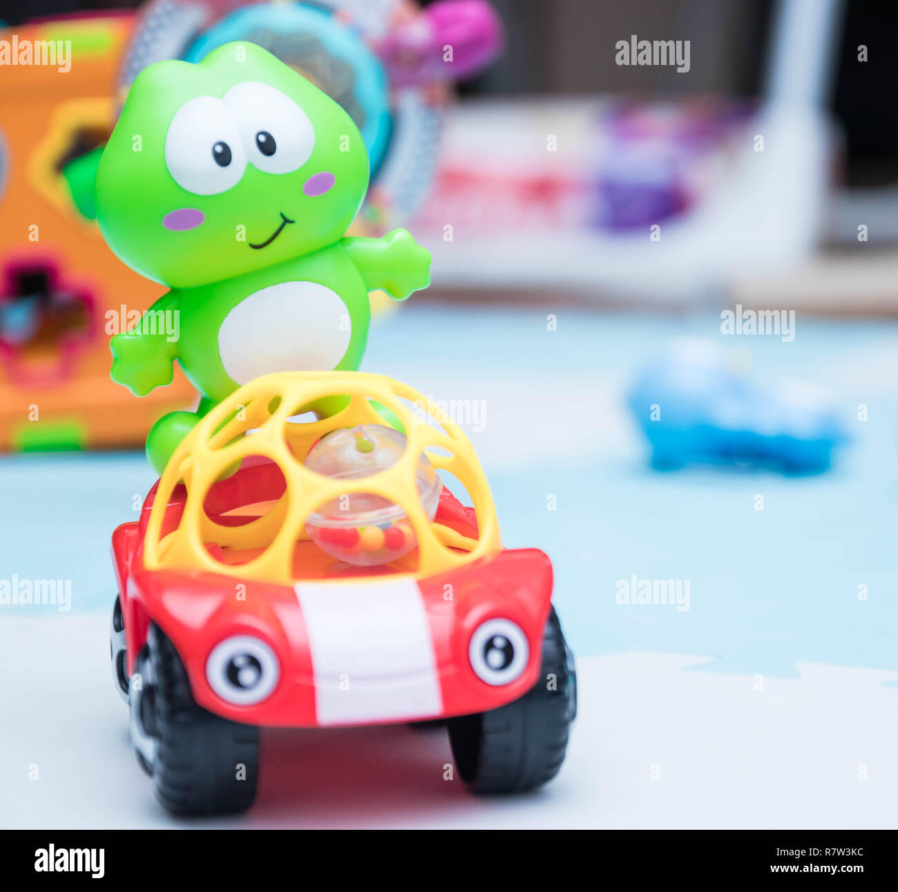 Children's toys. A small machine close-up for children. playing mat ...