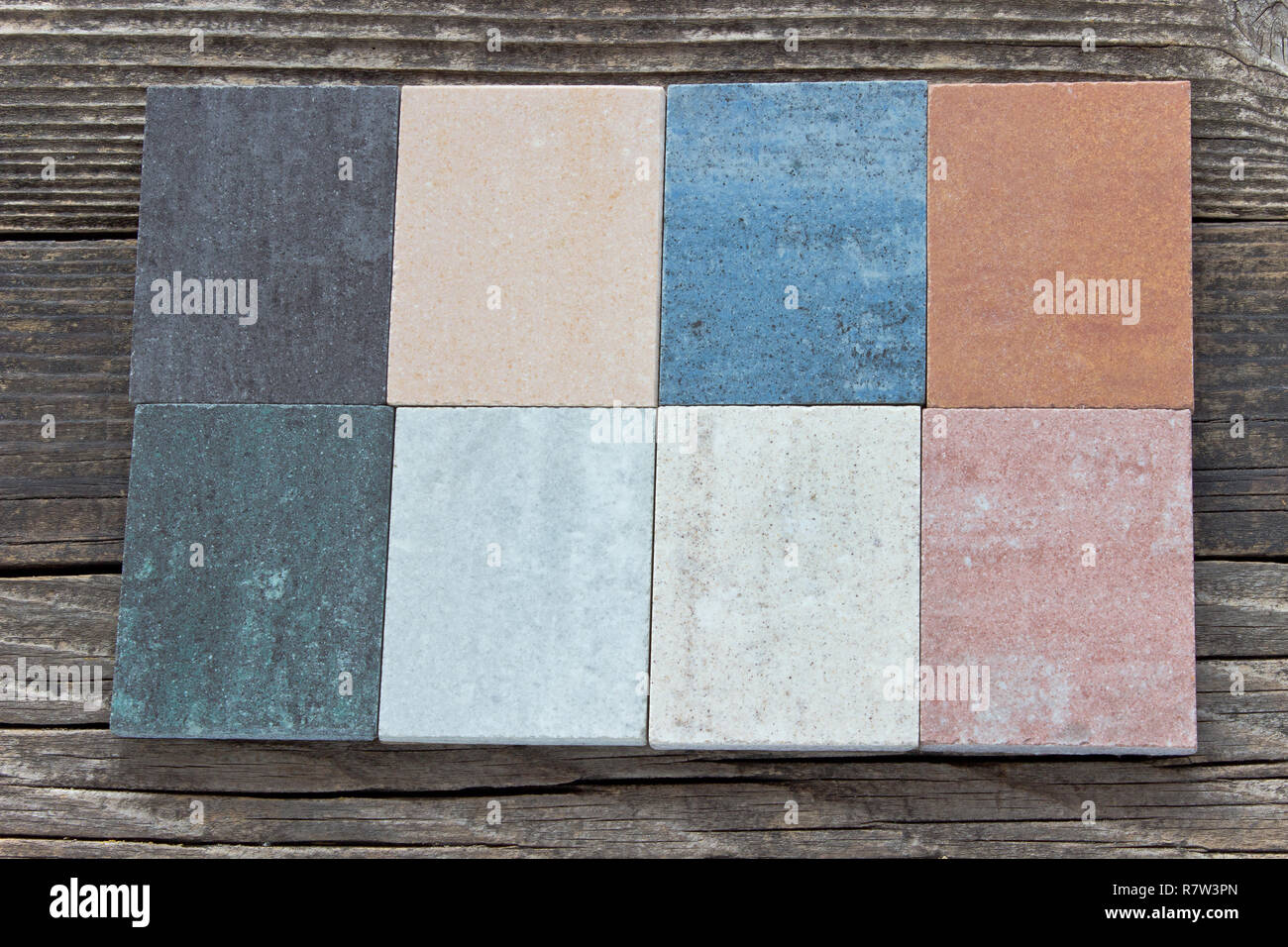 Tile samples on wooden background Stock Photo