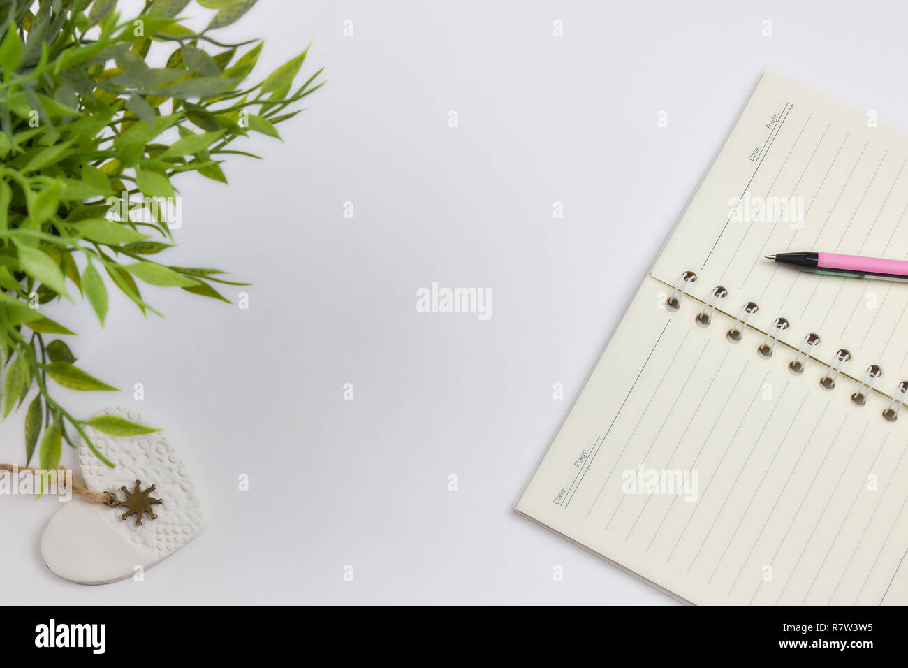 concept of recording your daily affairs. Notepad on a white background. Copy space layout Stock Photo