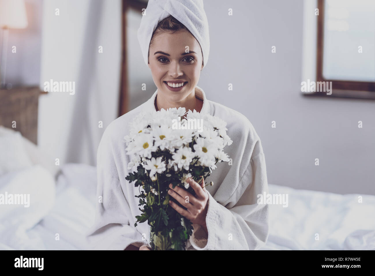 Young woman with bouquet of flowers Stock Photo