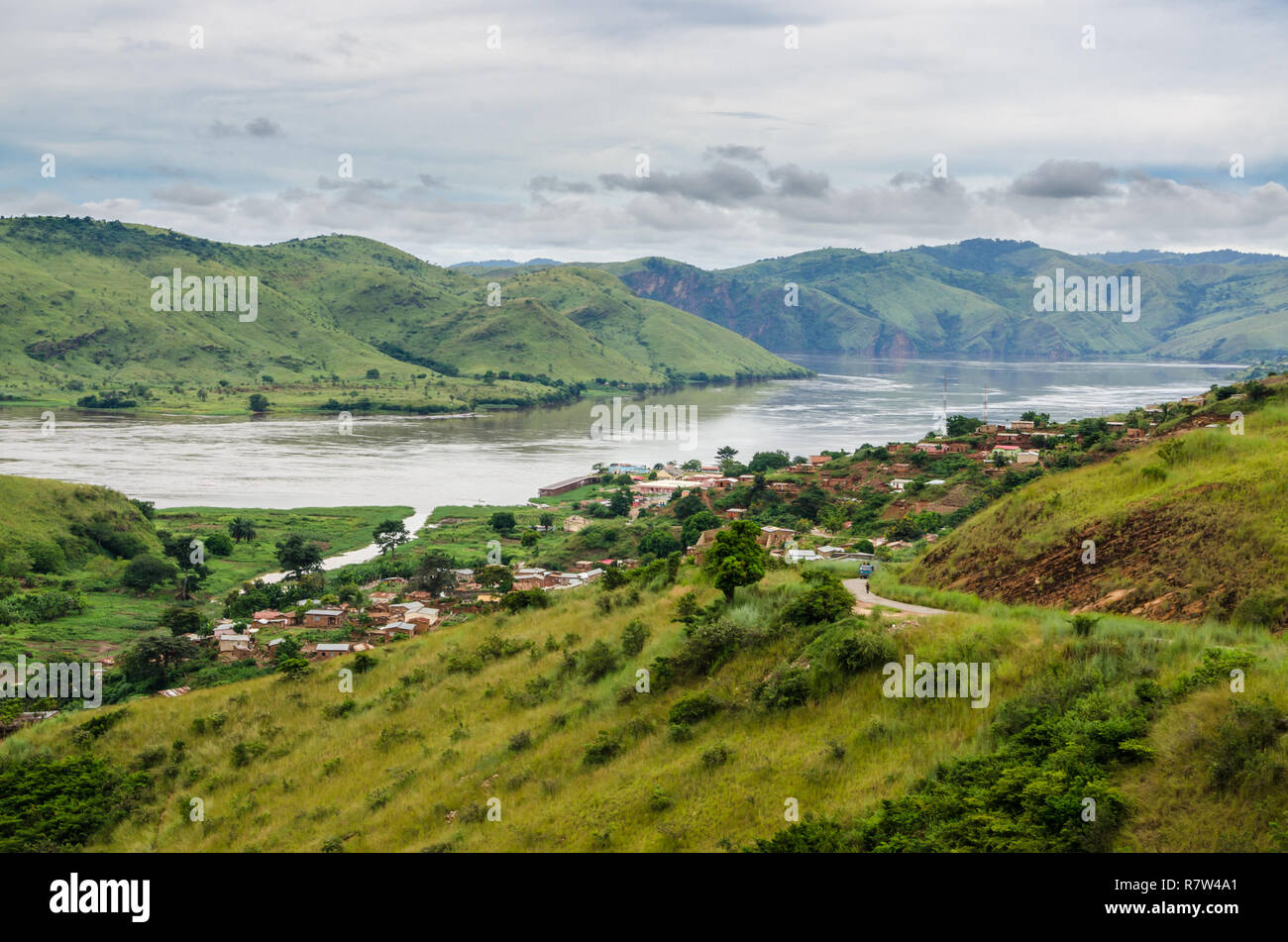 Small village in green hills at Congo River, Democratic Republic of Congo, Africa. Stock Photo