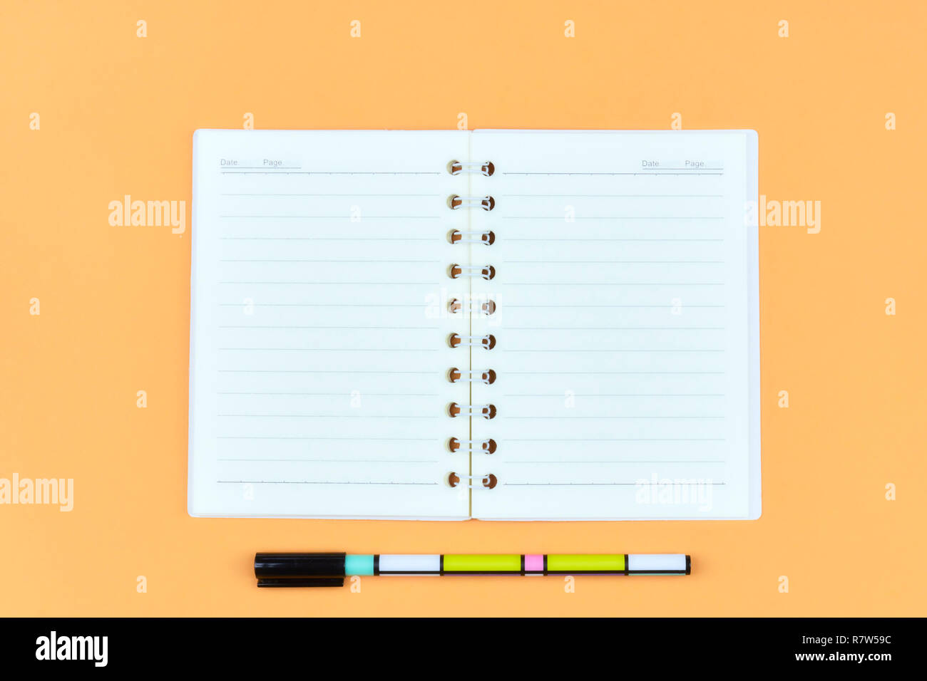Notepad for text on pink table with copy space. Education and office concept Stock Photo