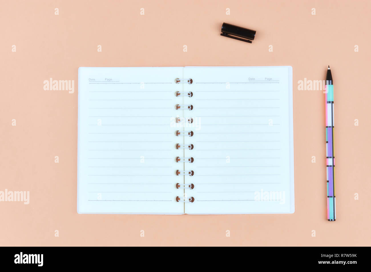 Notepad for text on pink table with copy space. Education and office concept Stock Photo