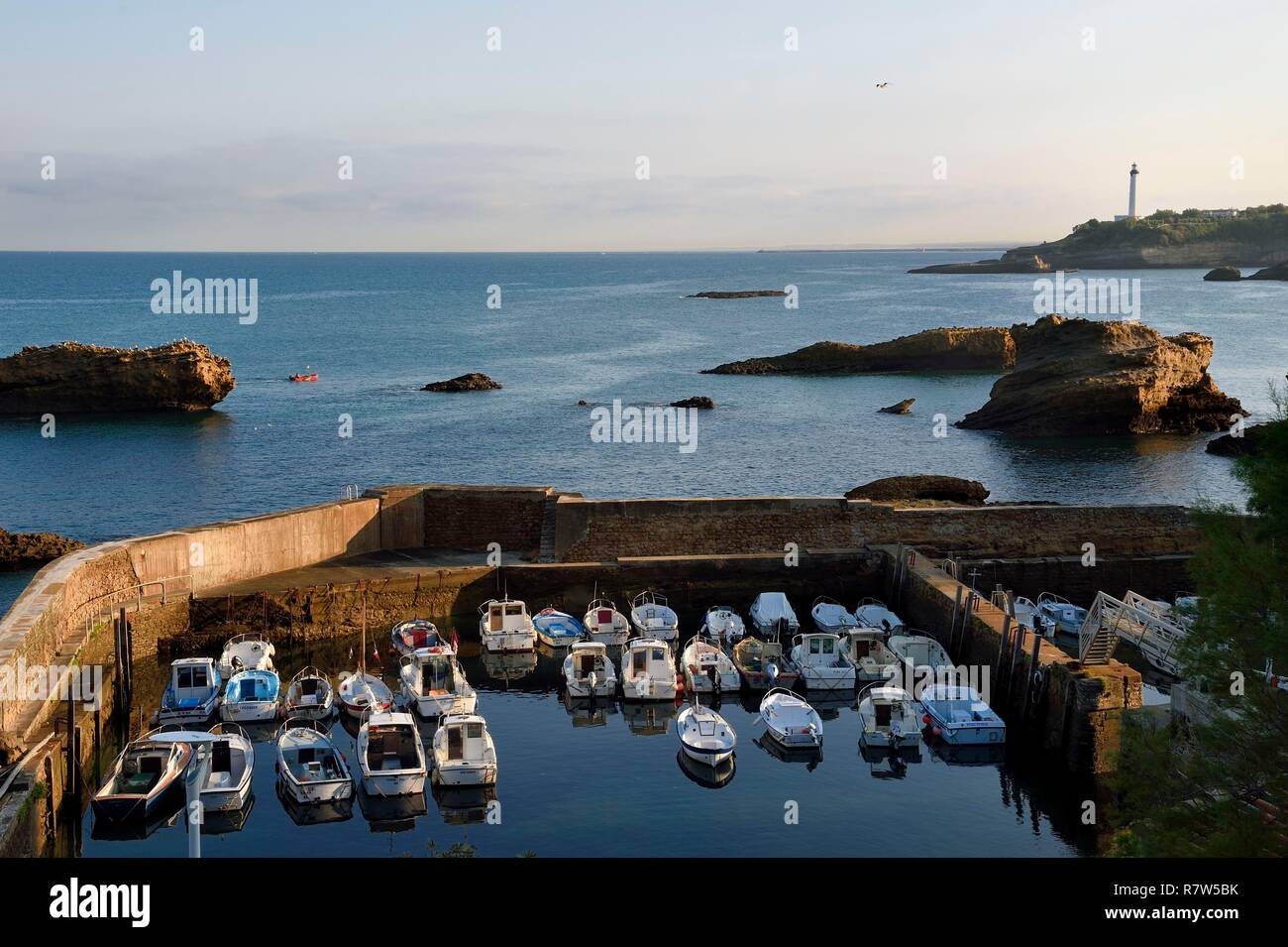 France, Pyrenees Atlantiques, Basque Country, Biarritz, Port des Pecheurs, the lighthouse in the background Stock Photo