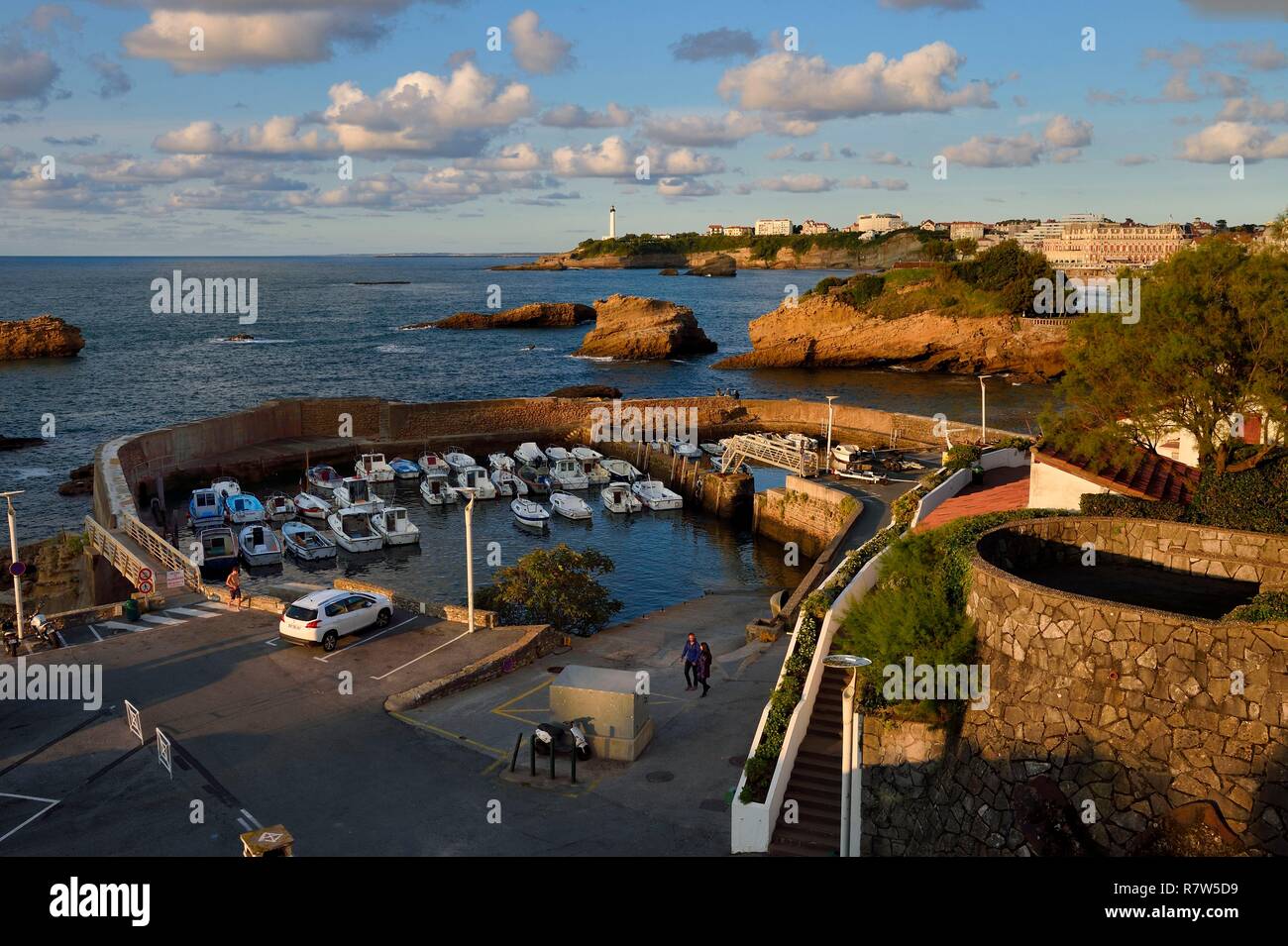 France, Pyrenees Atlantiques, Basque Country, Biarritz, Port des Pecheurs, the lighthouse and the Hotel du Palais located on Grande Plage (Great beach) in the background Stock Photo