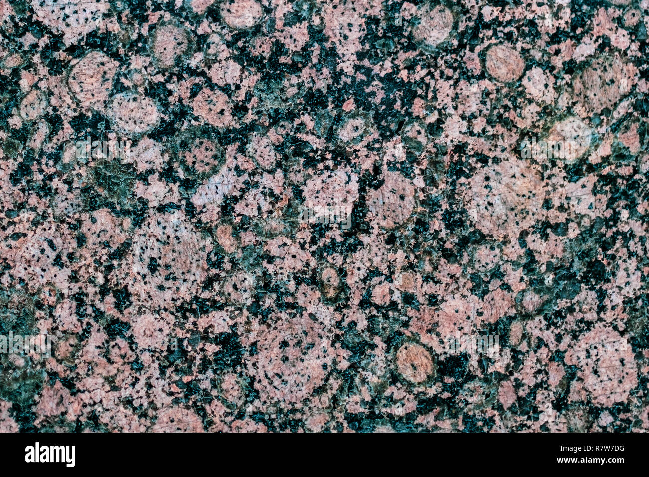 Natural stone. Pink granite. Black Granite. Grey Granite. Facing material. Granite texture. Bright hard granite rock texture. Granite stone background Stock Photo