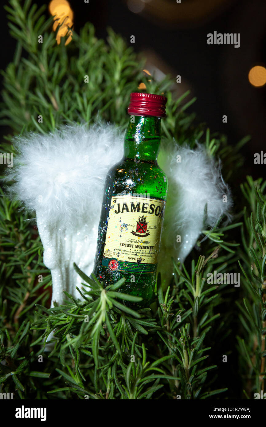 Miniature bottle of Jameson Irish Whiskey - as a handmade Christmas ornament for a Holiday Party Stock Photo