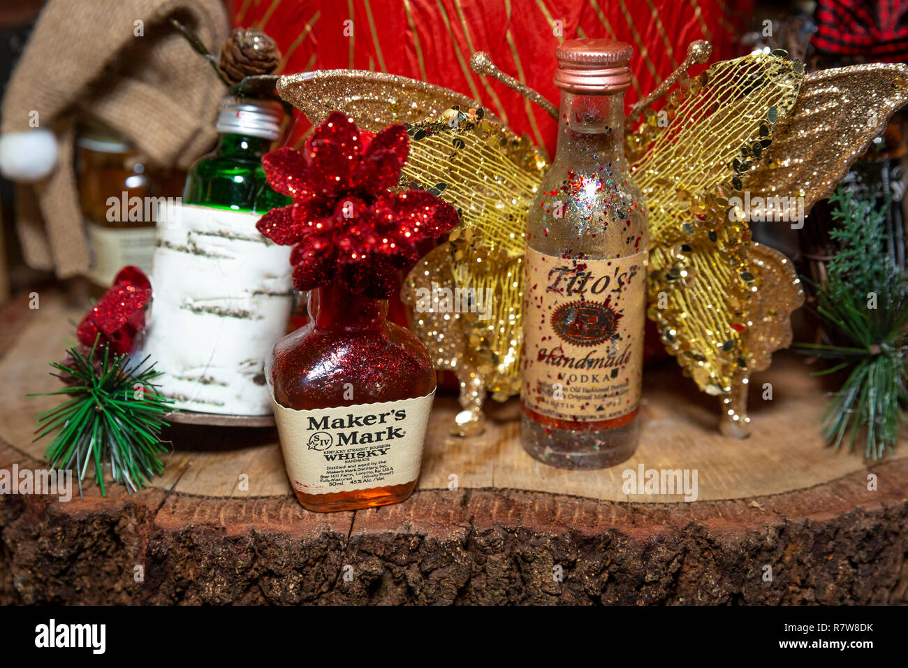 Miniature bottles of Tito's Handmade Vodka and Makers Mark Whisky - as a handmade Christmas ornament for a Holiday Party Stock Photo