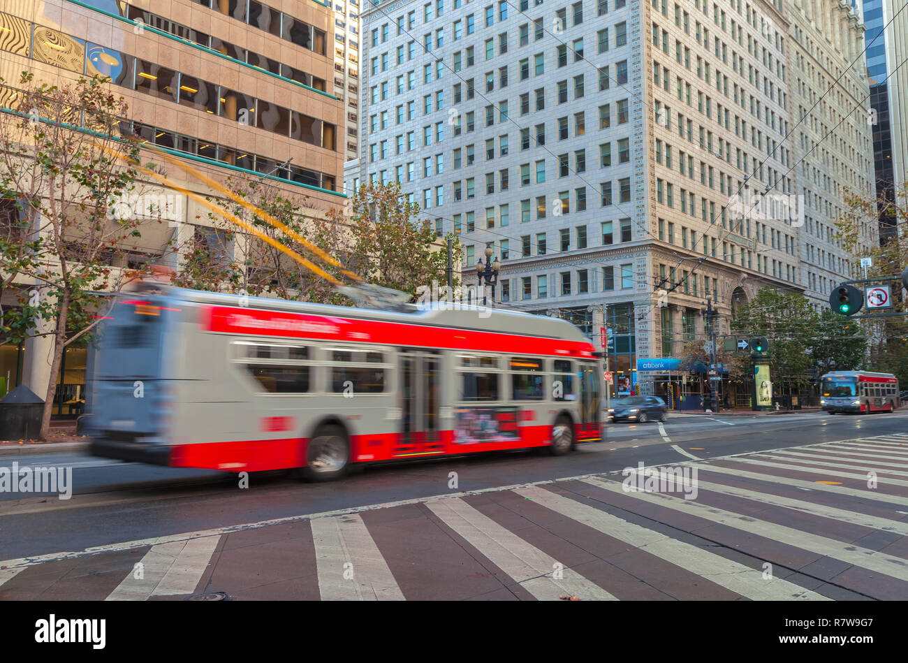 Trolley buses in motion on the Market Street in San Francisco