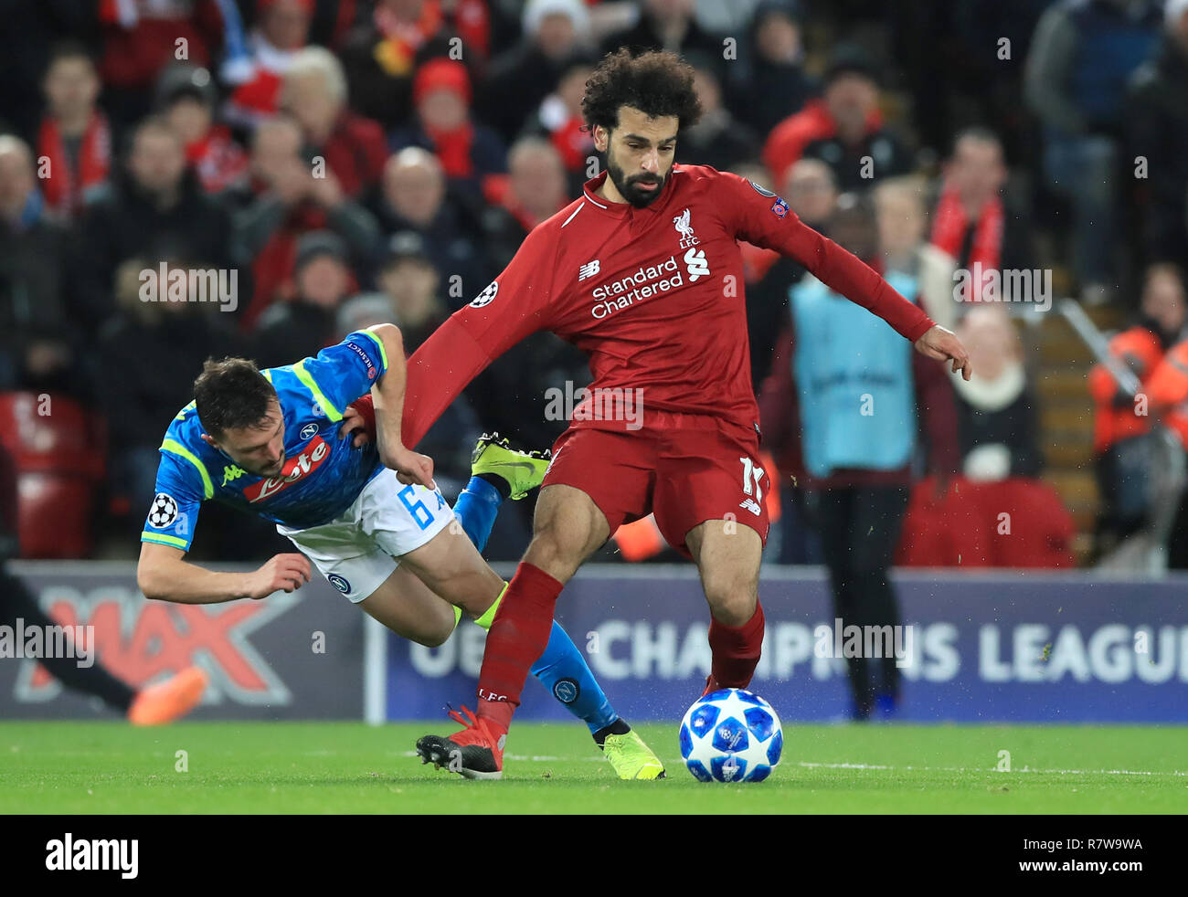 Napoli S Mario Rui Left And Liverpool S Mohamed Salah Battle For The Ball During The Uefa Champions League Match At Anfield Liverpool Stock Photo Alamy