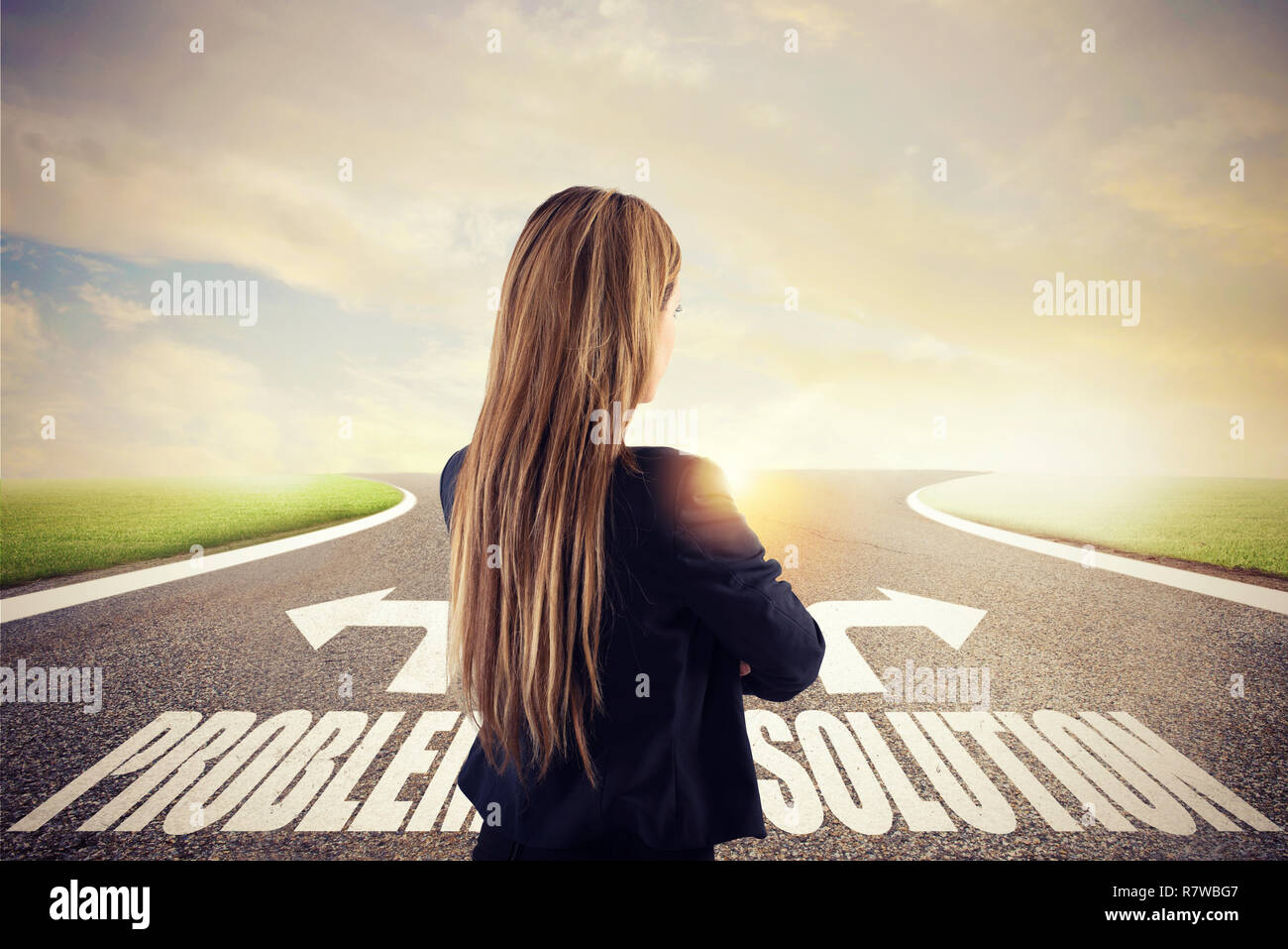 Businesswoman at a crossroads. She chooses the correct way. Concept of decision in business Stock Photo