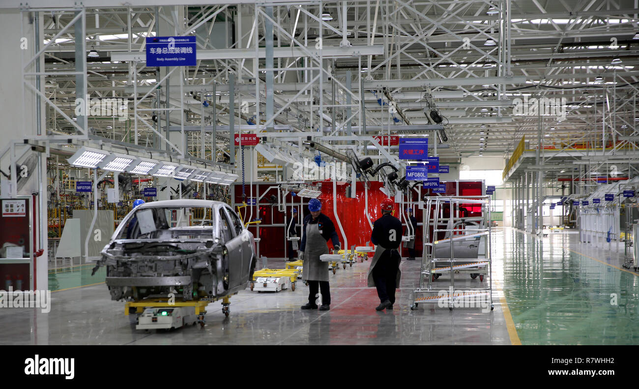 Sanmenxia, Sanmenxia, China. 11th Dec, 2018. Sanmenxia, CHINA-Workers are busy manufacturing electric vehicles at Suda Electric Vehicle Company in Sanmenxia, central ChinaÃ¢â‚¬â„¢s Henan Province. Credit: SIPA Asia/ZUMA Wire/Alamy Live News Stock Photo