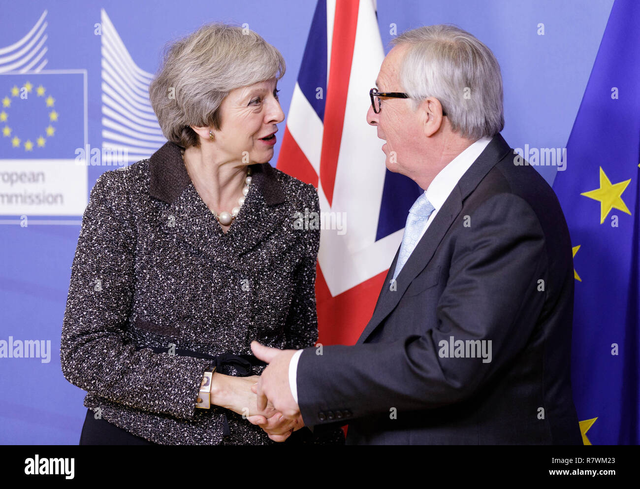 Brussels. 11th Dec, 2018. British Prime Minister Theresa May (L) shakes ...