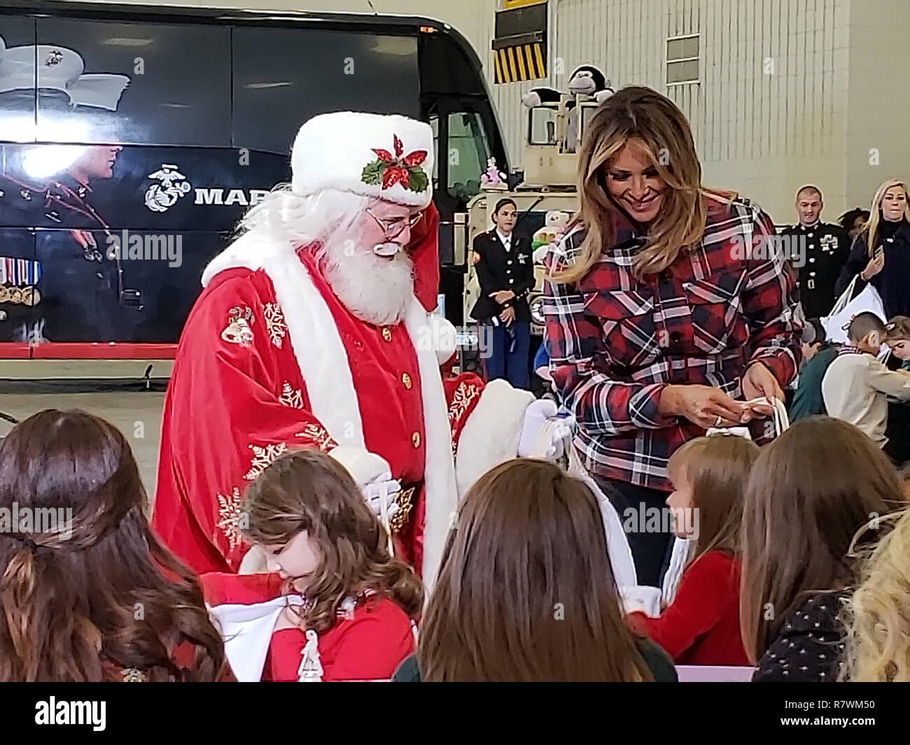 Washington DC, USA. December 11, 2018, Washington DC, USA:  First Lady Melania Trump and Santa Claus greet children of Military personnel during the annual Toys for Tots sponsored by the US Marine Corps at Joint Base Andrews in Washington DC. Credit: Patsy Lynch/Alamy Live News Stock Photo