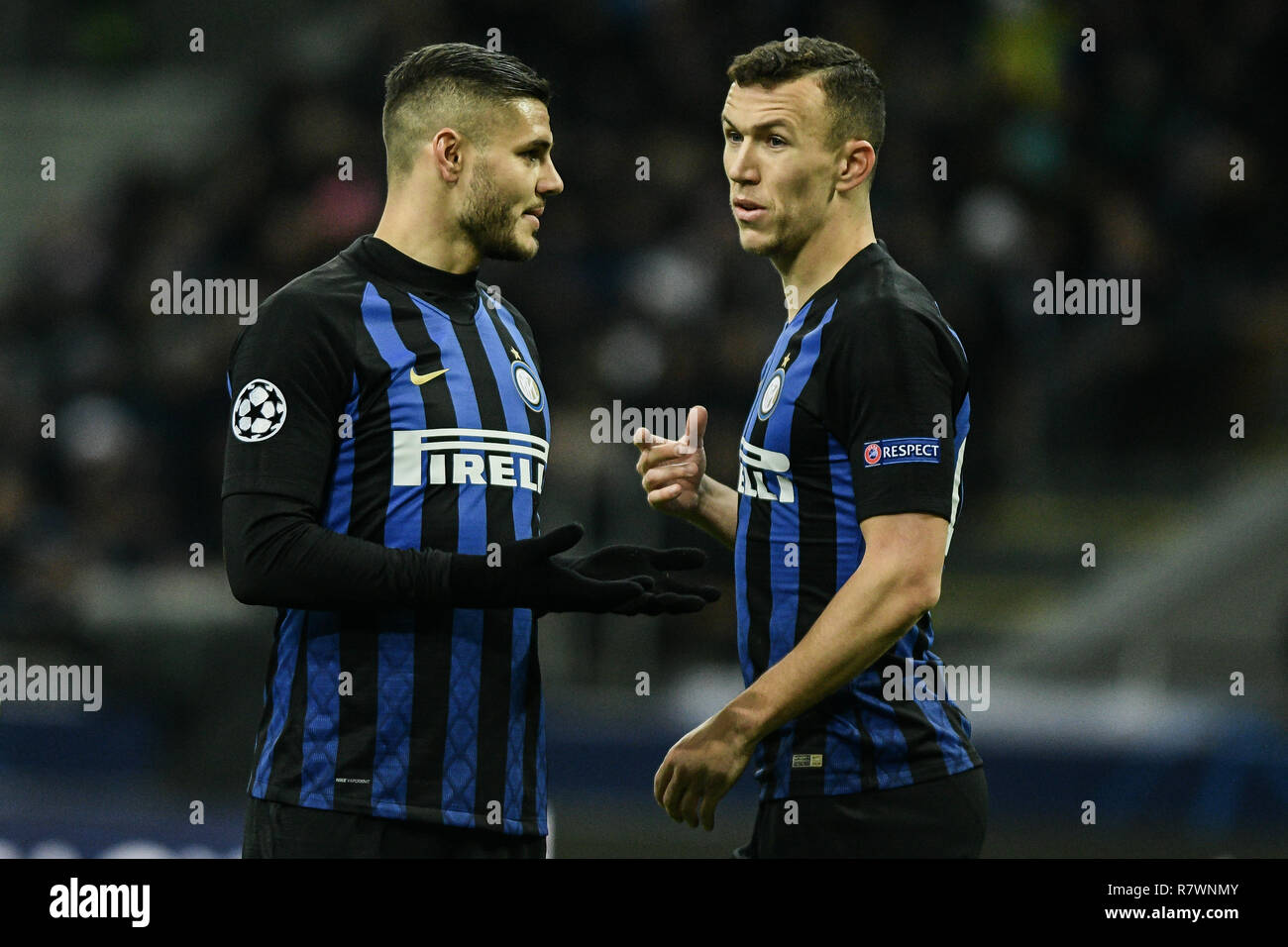 Milan, Italy. 11th December, 2018. Forward Mauro Icardi (Inter) and Midfielder Ivan Perisic (Inter) talk and gesture during the UEFA Champions League football match, Inter Milan vs PSV Eindhoven at San Siro Meazza Stadium in Milan, Italy on 11 December 2018 Credit: Piero Cruciatti/Alamy Live News Stock Photo