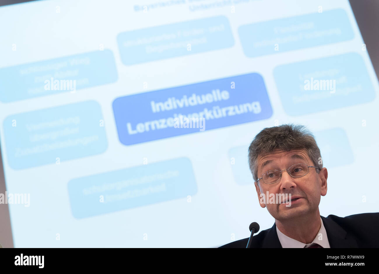 12 December 2018, Bavaria, München: Michael Piazolo (Free Voters), Bavarian Minister of State for Education and Culture, speaks at a press conference on the planned 'fast lane' at the nine-year high school. The so-called individual shortening of learning time is intended to give pupils the opportunity to complete their Abitur after eight school years as before. Photo: Peter Kneffel/dpa Stock Photo
