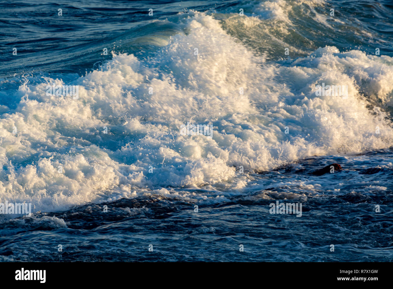 Background with dark blue ocean water waves close up on sunset Stock ...