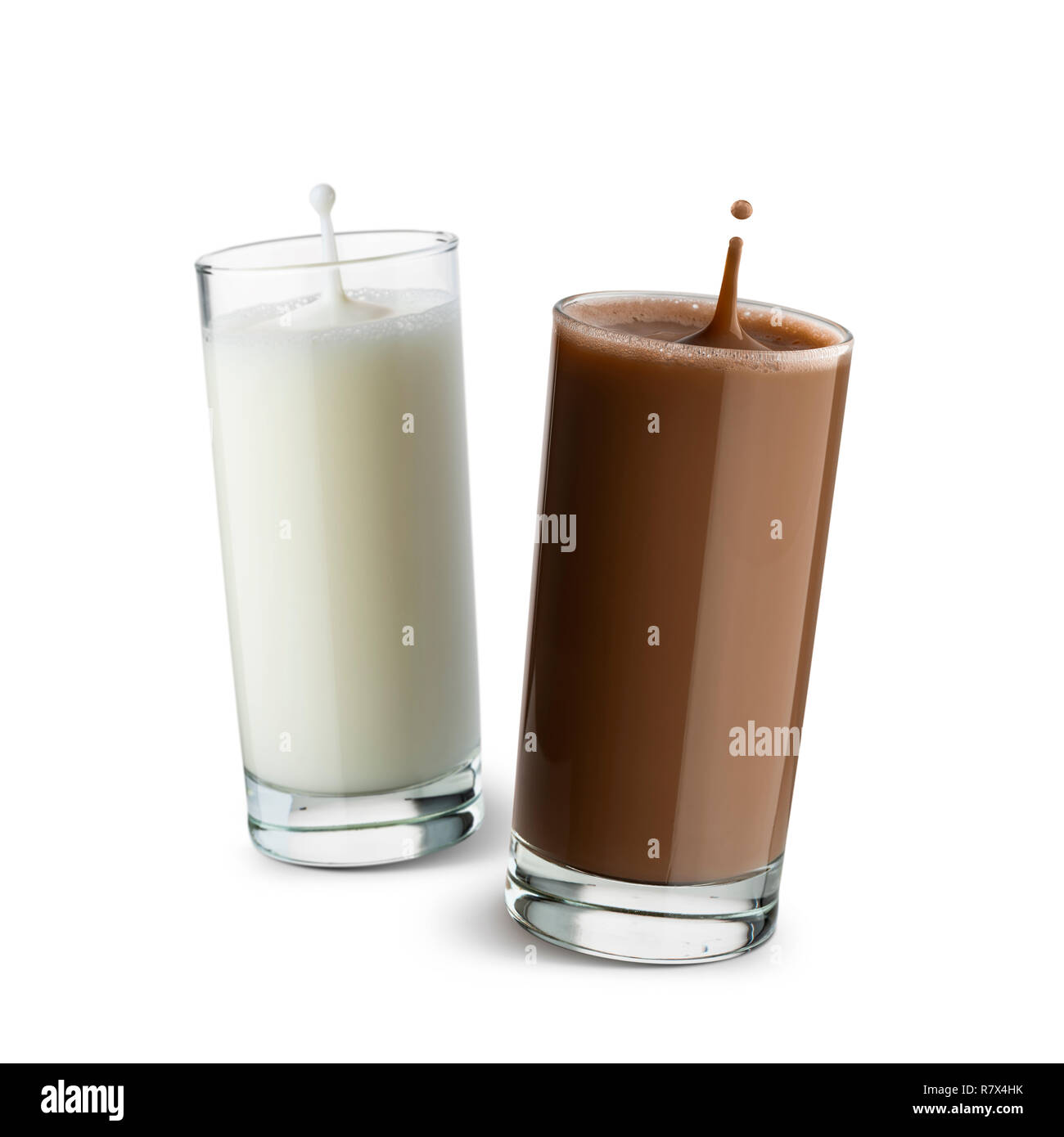 glasses full of milk and chocolate with jumping drops on white background. Stock Photo