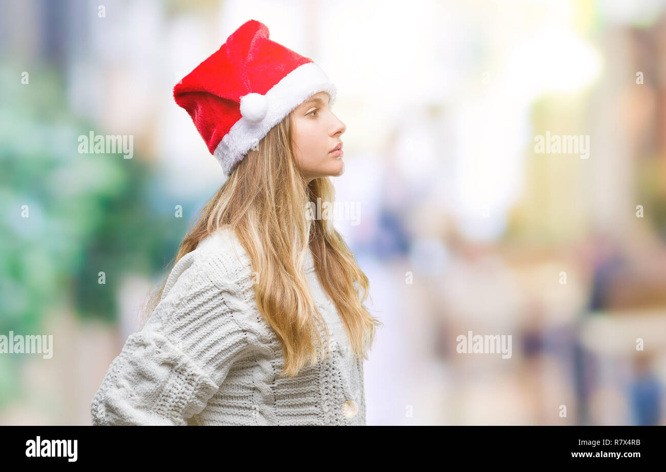 Young Beautiful Blonde Woman Wearing Christmas Hat Over Isolated
