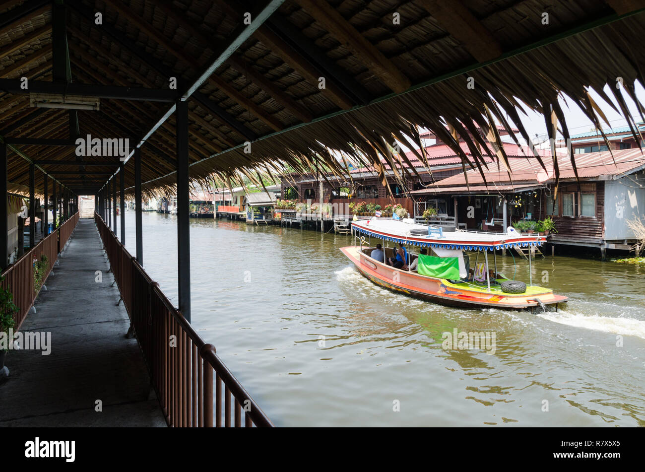 Thai longtail boat sailing Chap Phraya river, Thonburi, Bangkok, Thailand Stock Photo