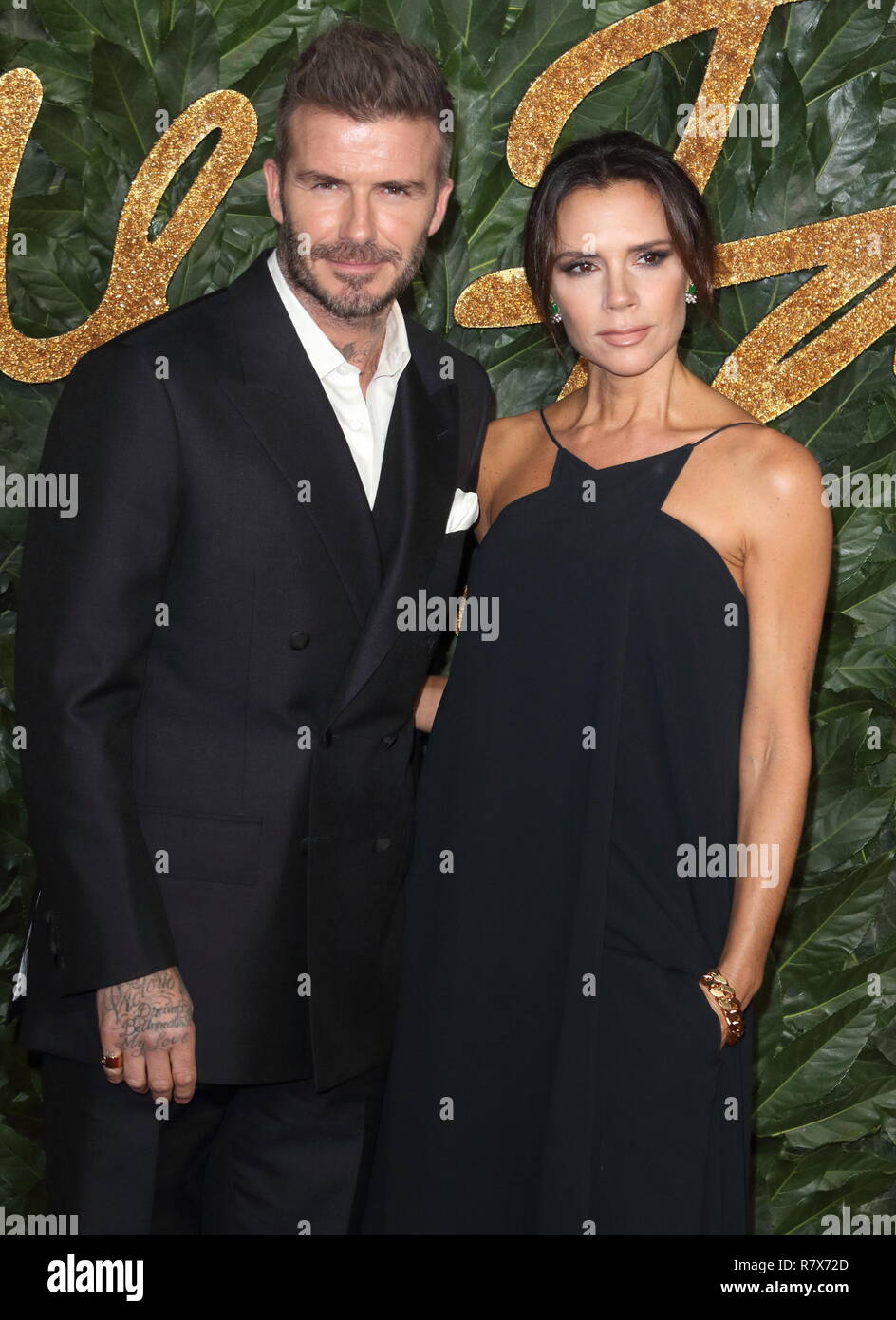 David and Victoria Beckham are seen on the red carpet during the Fashion Awards 2018 at the Royal Albert Hall, Kensington in London. Stock Photo