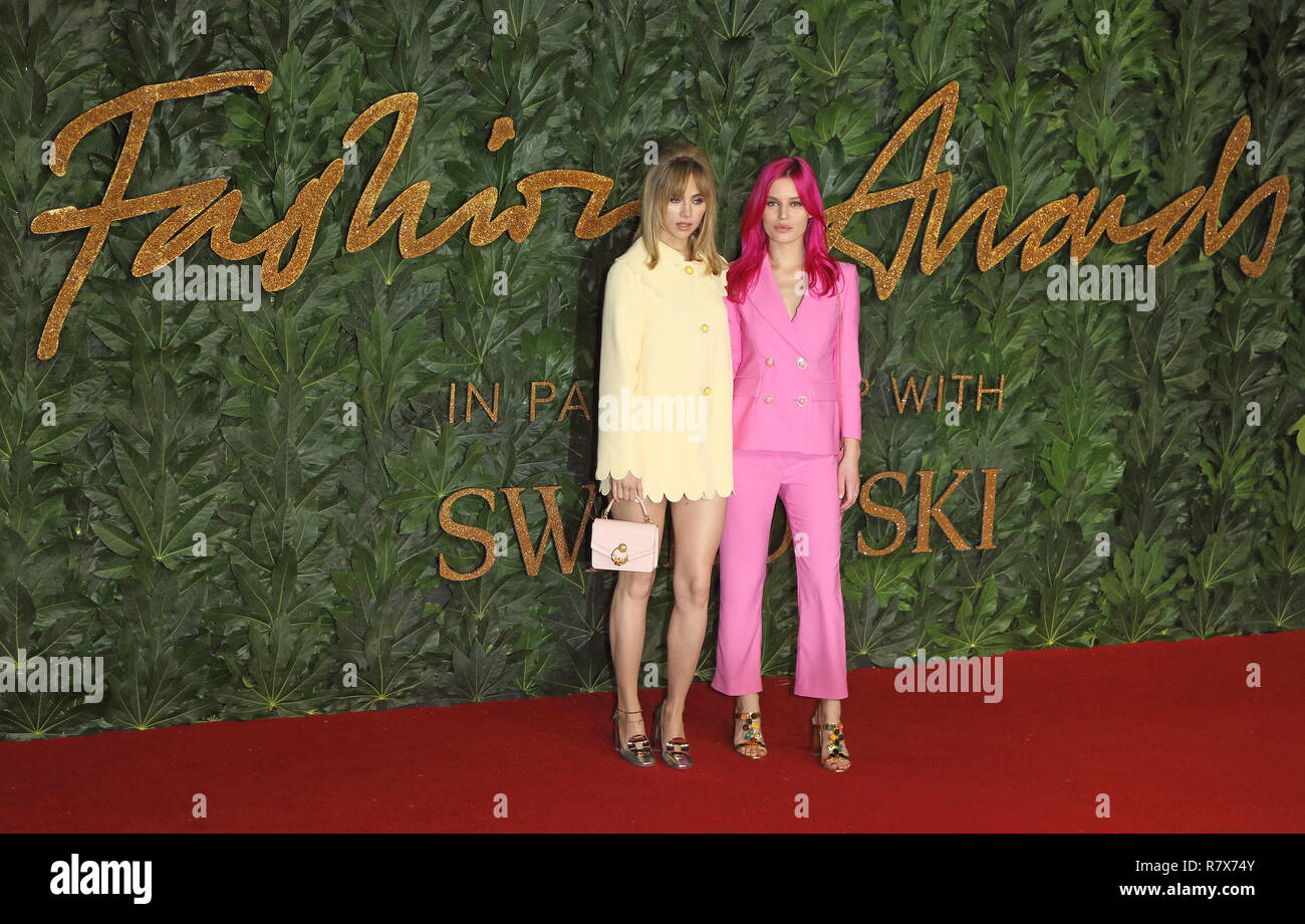 Suki Waterhouse and Georgia May Jagger are seen on the red carpet during the Fashion Awards 2018 at the Royal Albert Hall, Kensington in London. Stock Photo