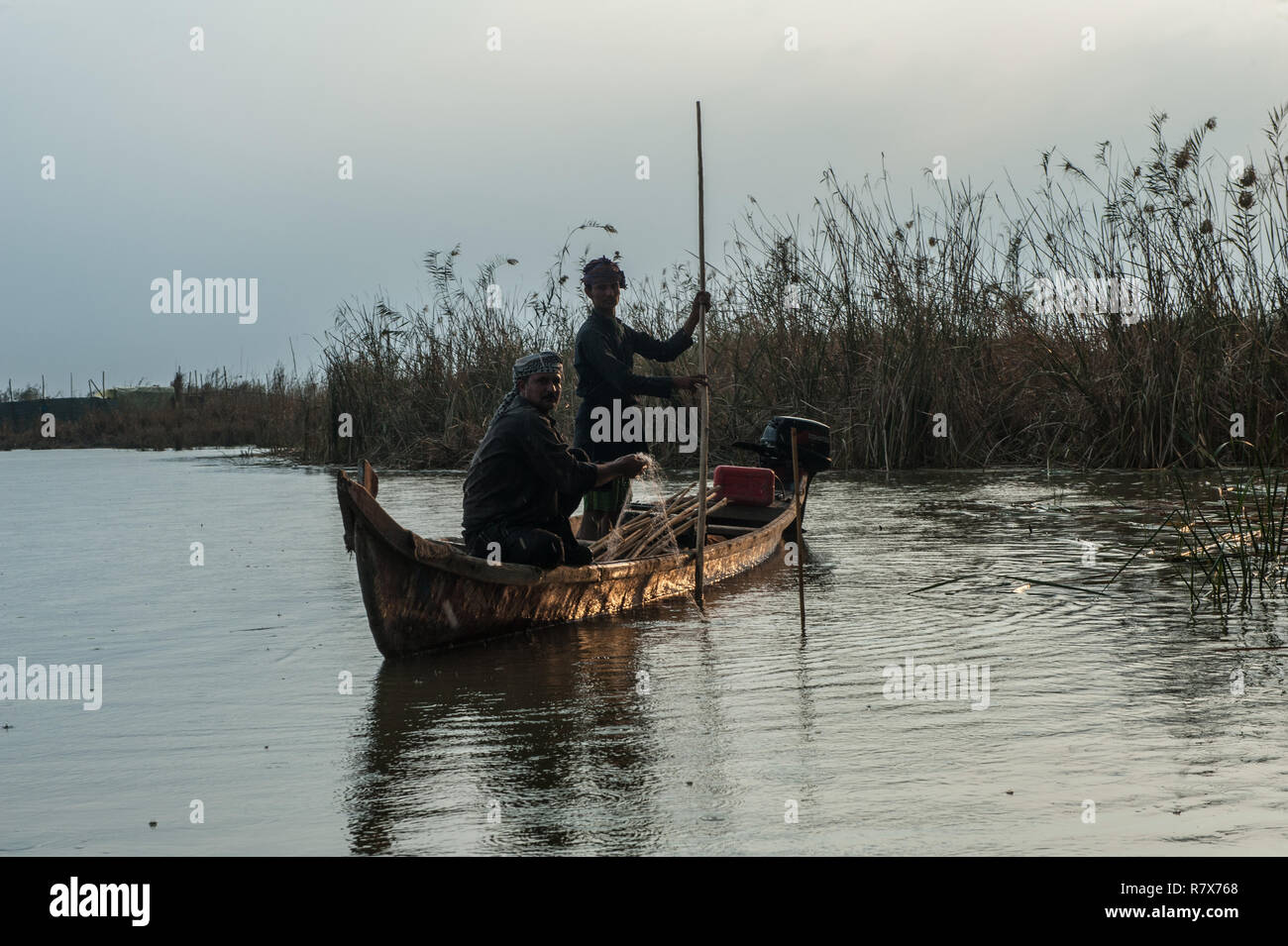 Marsh Arab fishermen seen in the Central Marshes of Southern Iraq. Climate change, dam building in Turkey and internal water mismanagement are the main causes of a severe drought in the southern wetlands of Iraq. Stock Photo