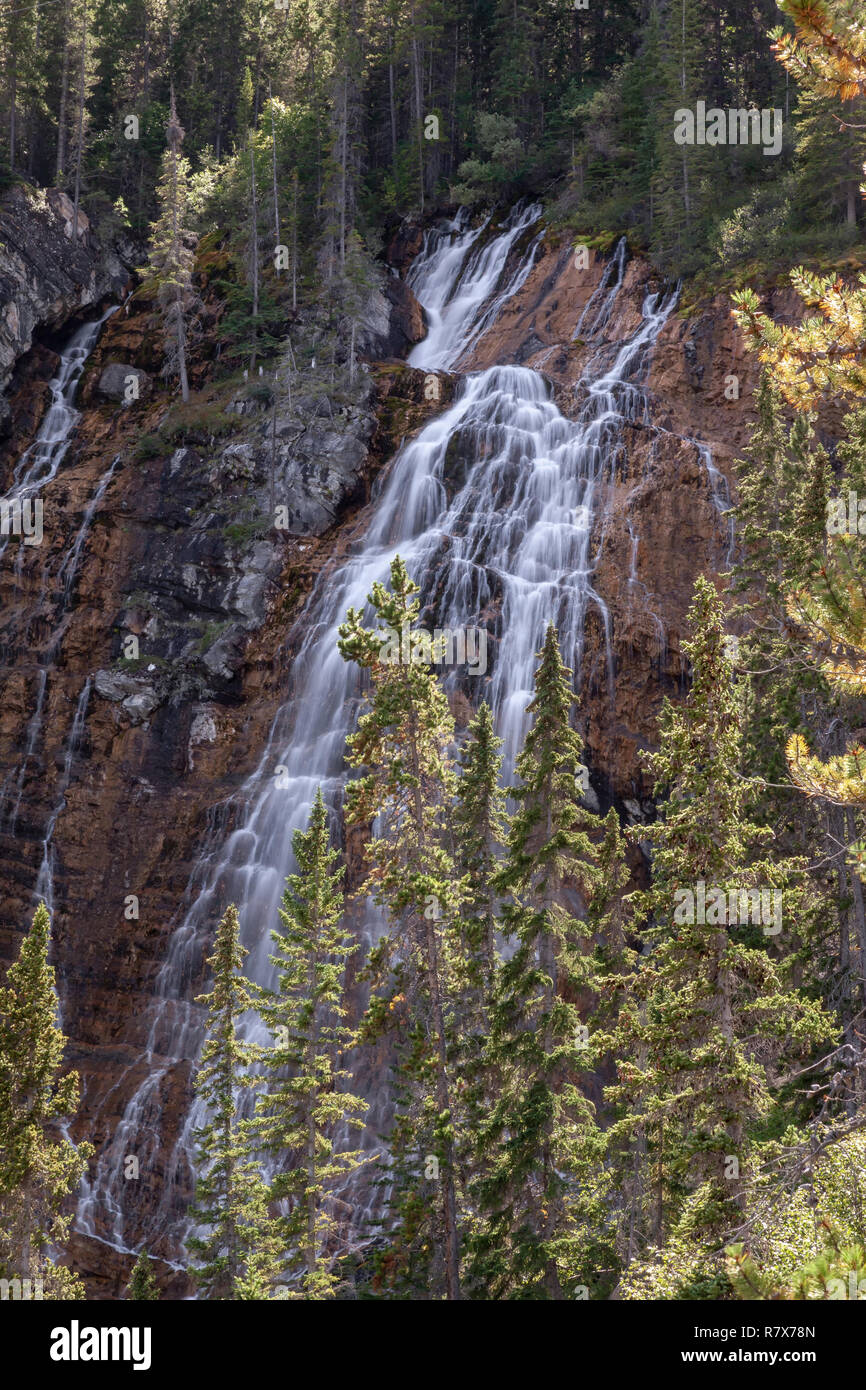 View of the falls off of the Grassi Lakes trail just outside of Canmore, beautiful natural waterfall in the forest in Canmore, in the Canadian Rockies Stock Photo