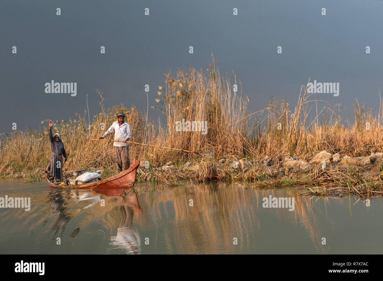Marsh Arab fishermen seen fishing in the Central Marshes of Southern Iraq. Climate change, dam building in Turkey and internal water mismanagement are the main causes of a severe drought in the southern wetlands of Iraq. Stock Photo