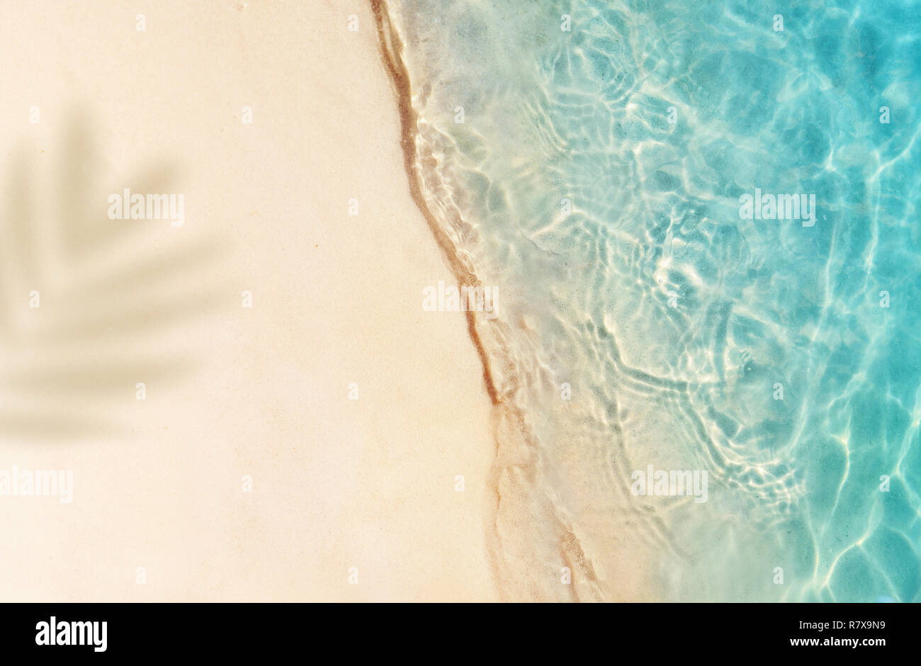 Soft beautiful ocean wave on sandy beach. Summer background. Stock Photo