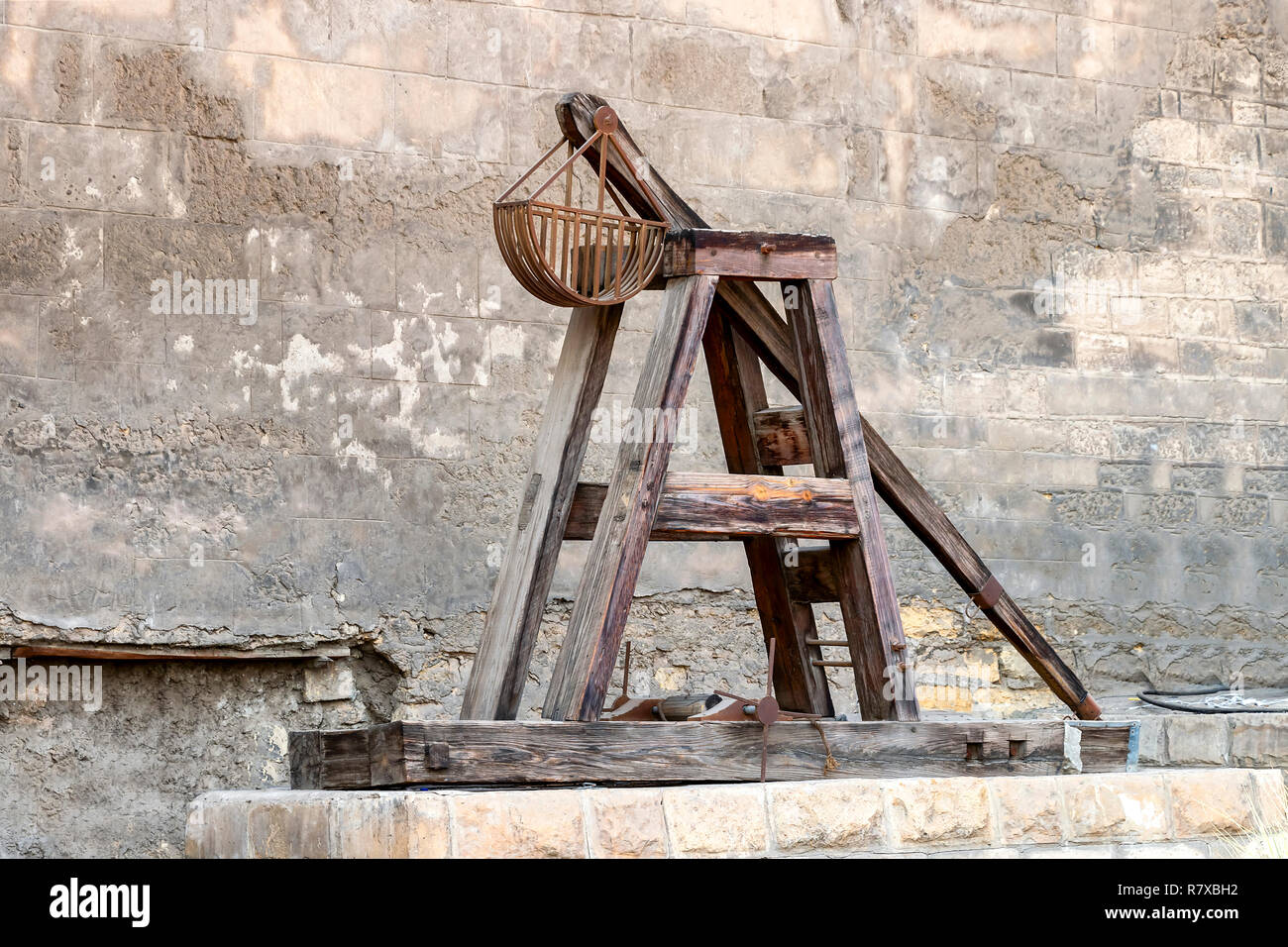 Wooden Medieval Catapult. Ballistic Device. Ancient Military Technology Stock Photo