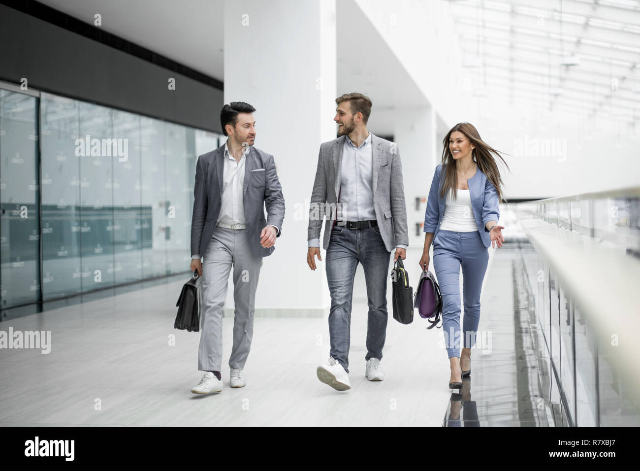 business team are walking in the spacious hall Stock Photo - Alamy