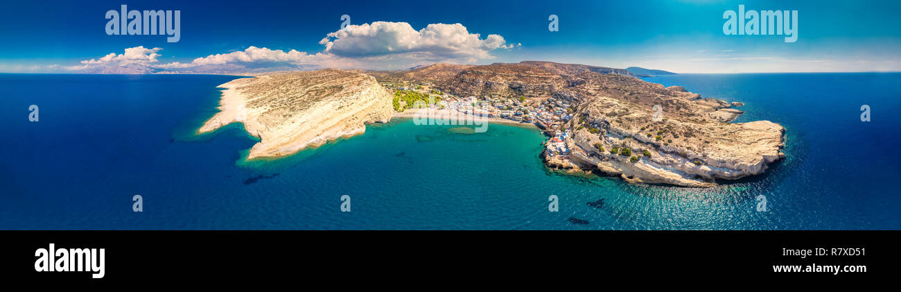 Aerial view of Matala beach on Crete island with azure clear water, Greece, Europe. Crete is the largest and most populous of the Greek islands. Stock Photo